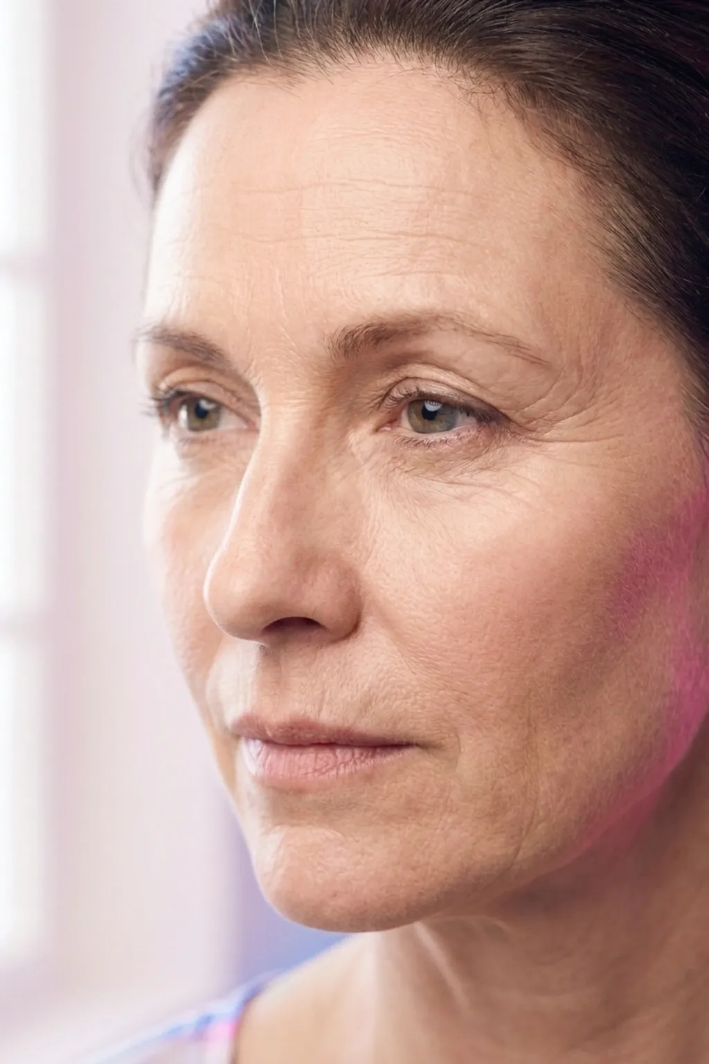 Close-up of fine lines and forehead creases on a mature face during a skin assessment at Applegate MedSpa Covington