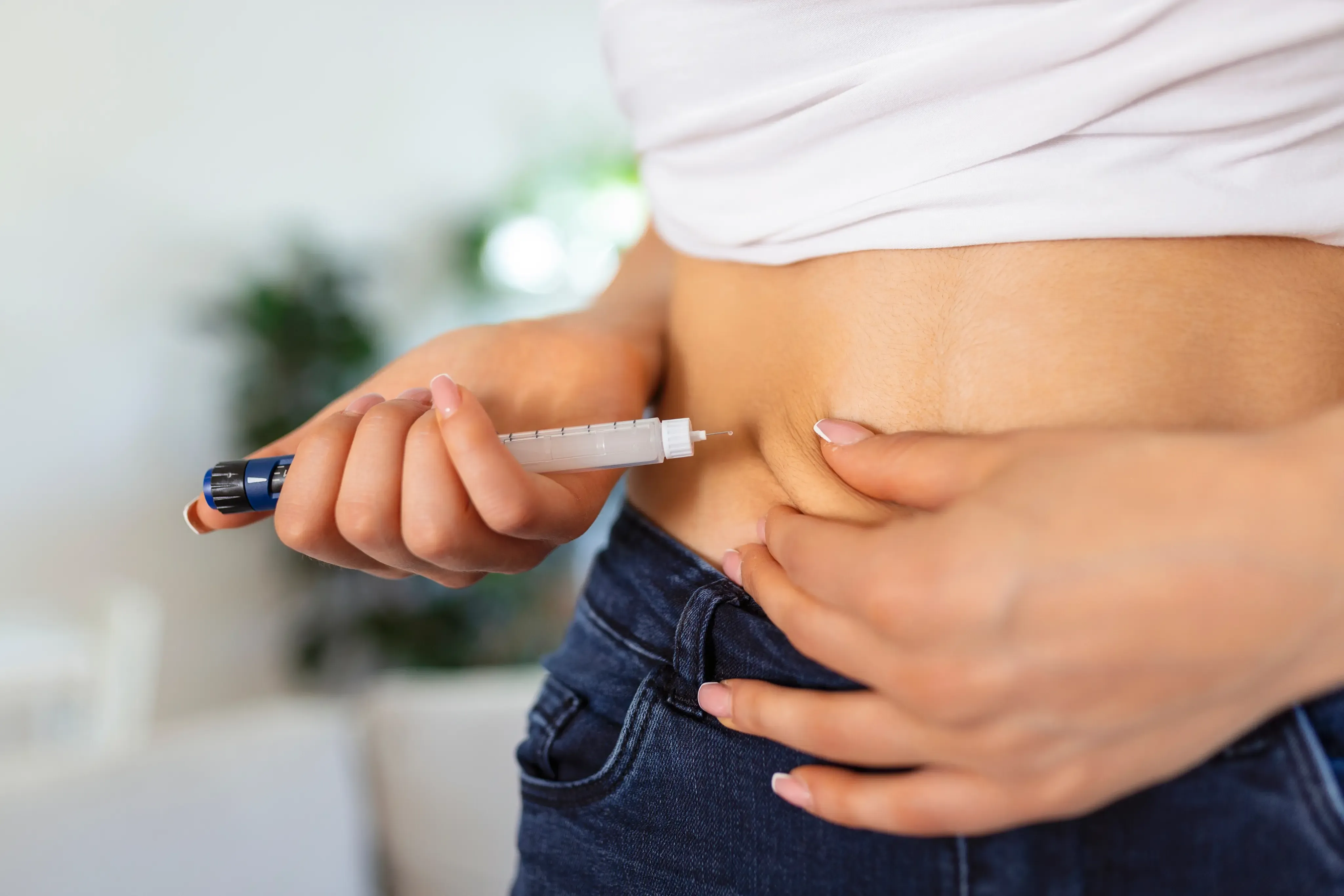 Two weekly injectable pens beside a tape measure representing a physician-supervised weight loss comparison