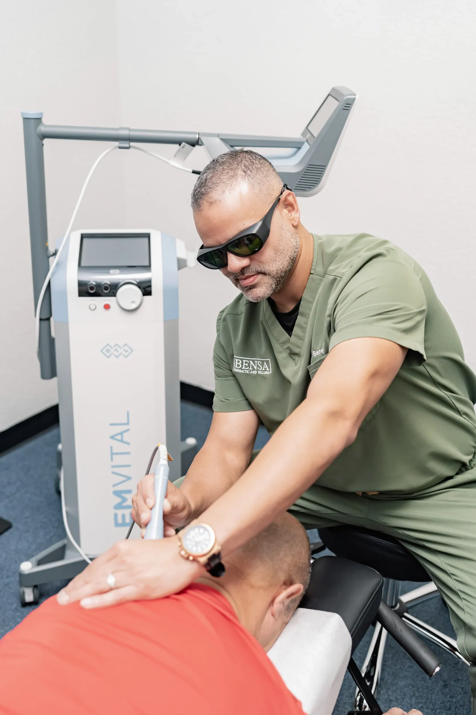 Patient receiving pain relief treatment with no text or labels visible at Bensa Chiropractic and Wellness in Bradenton Florida