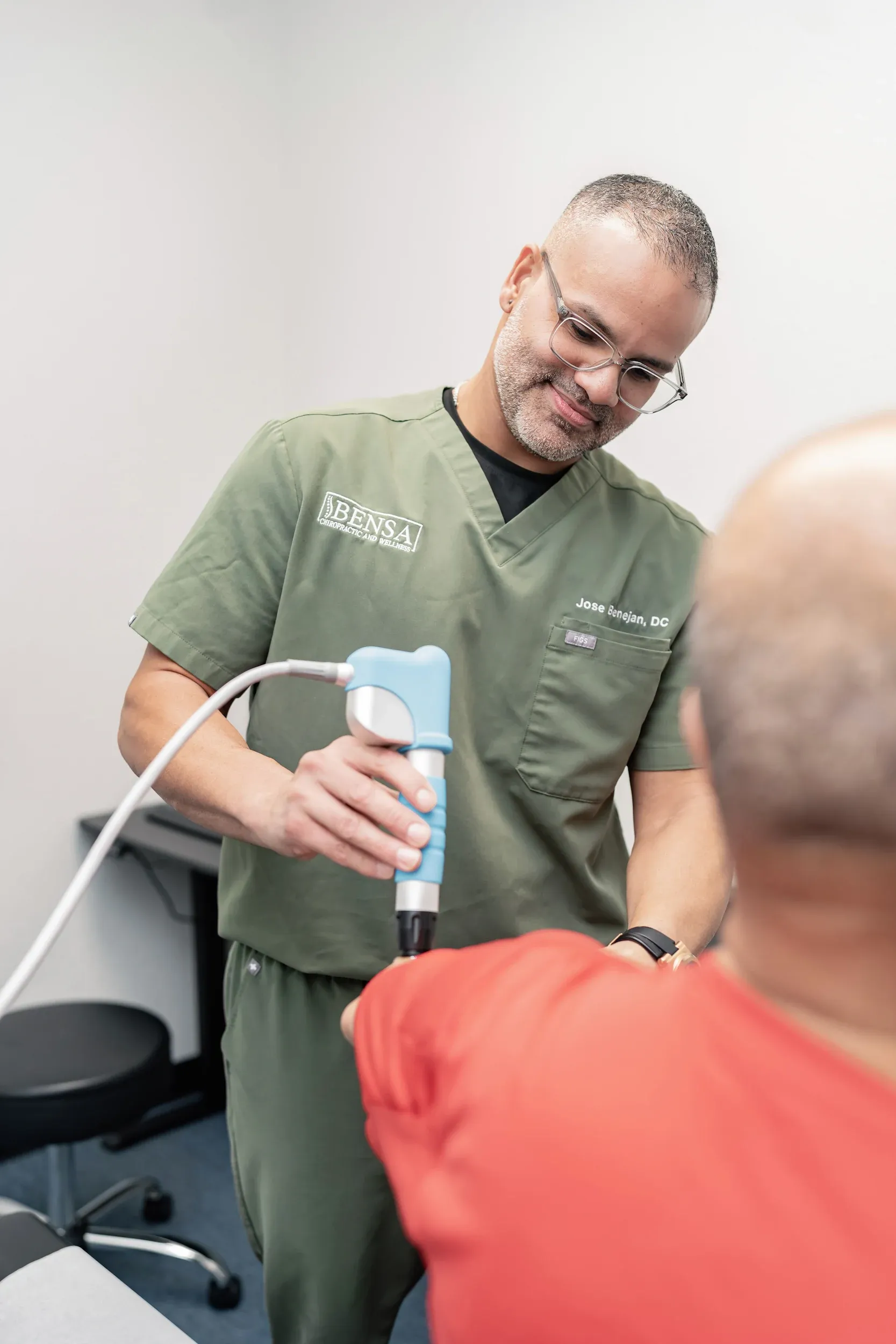 Patient receiving pain relief treatment with no text or labels visible at Bensa Chiropractic and Wellness in Bradenton Florida