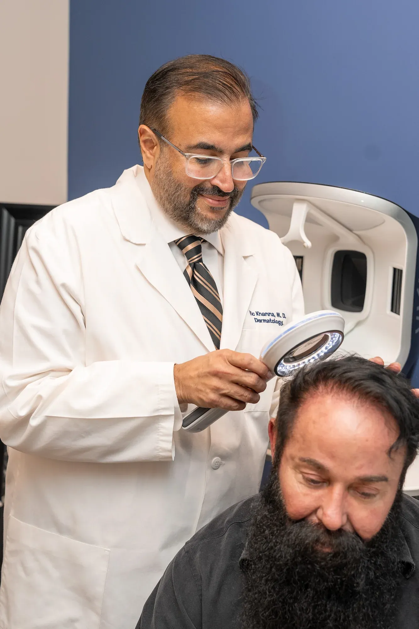 Dr. Vic Khanna consulting with a hair restoration patient at DSI Hair Algonquin