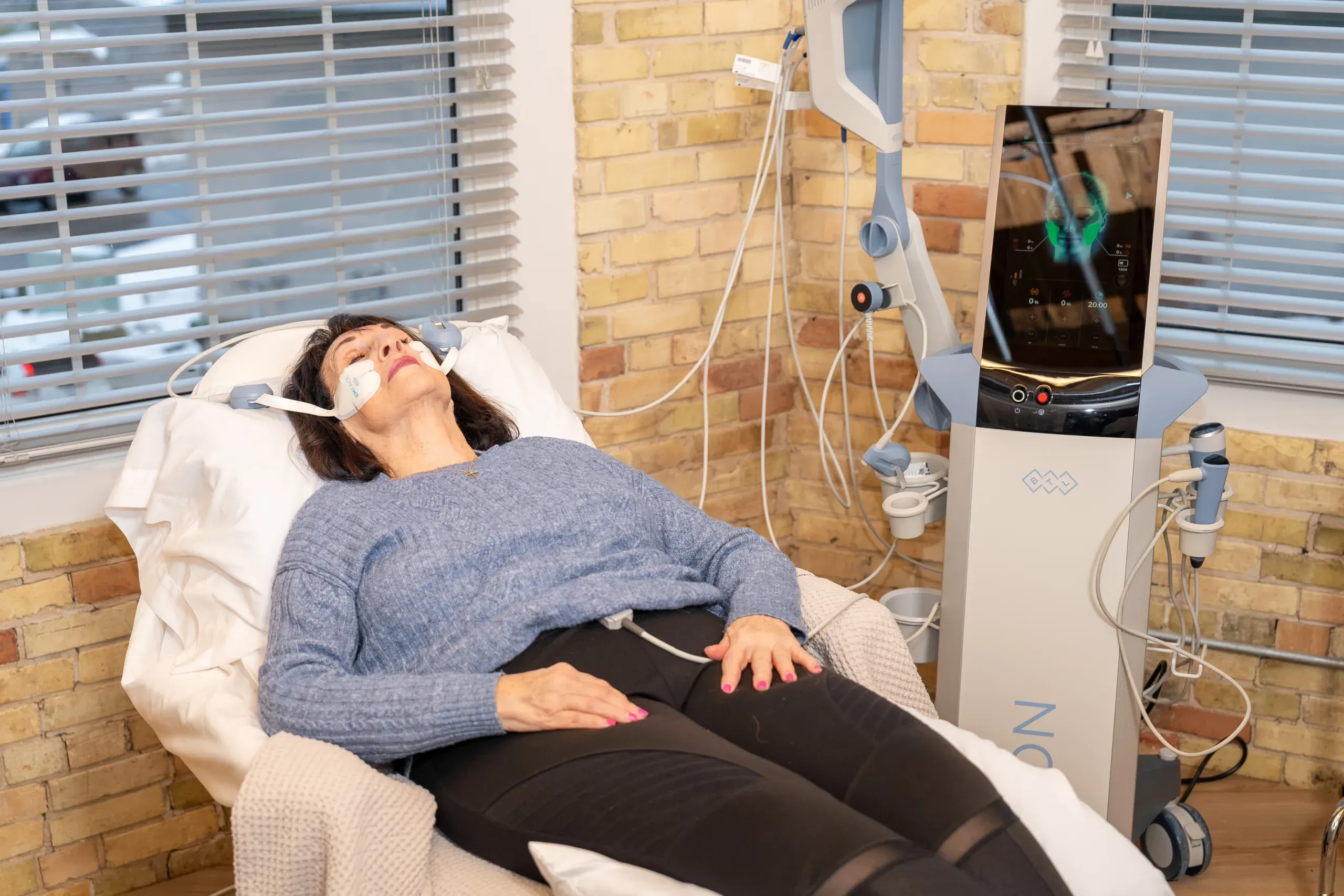 Woman with lifted youthful facial contours after Emface treatment at Eternal Wellness Medical Spa in Traverse City MI