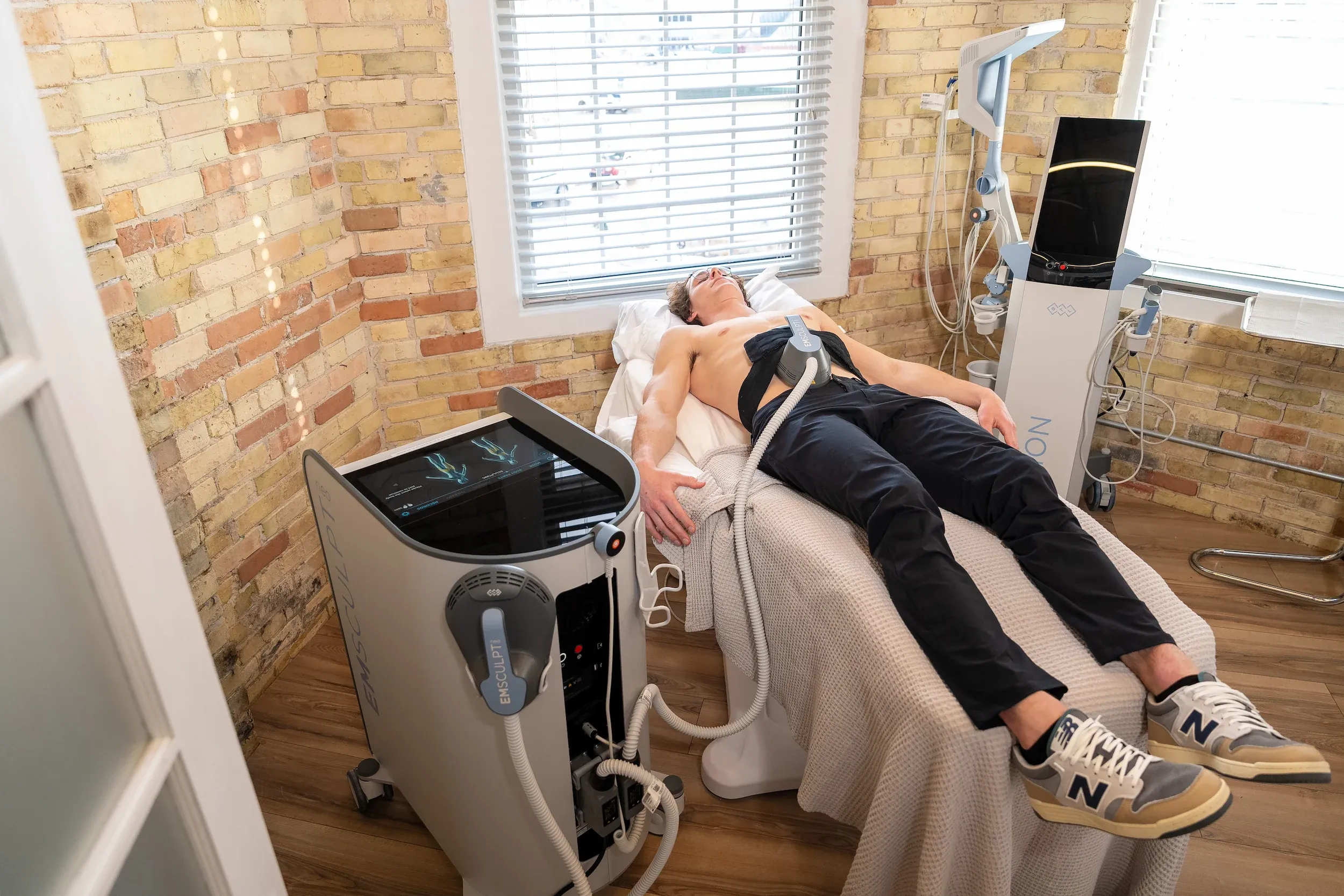 Patient consultation for Emsculpt Neo at Eternal Wellness Medical Spa Traverse City