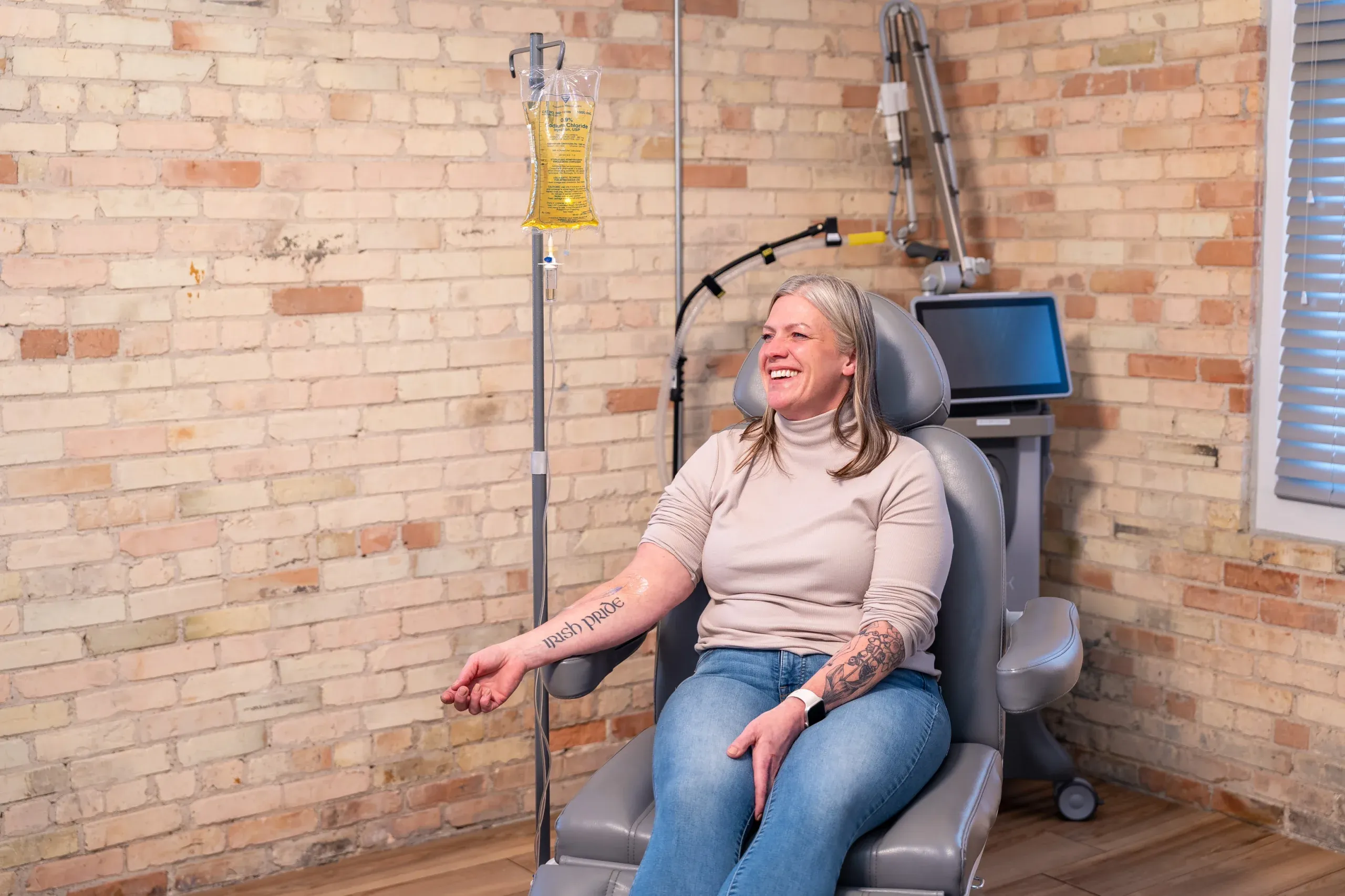 Patient receiving immune support IV therapy infusion at Eternal Wellness Medical Spa in Traverse City MI