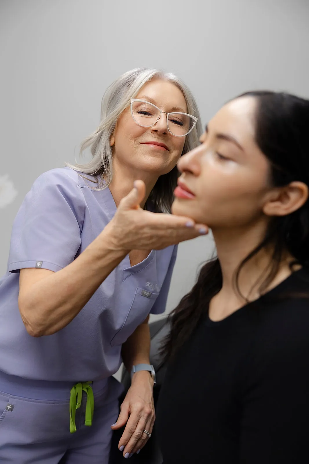 Patient consulting with Keely Phelps PA about Mint Condition Facial benefits