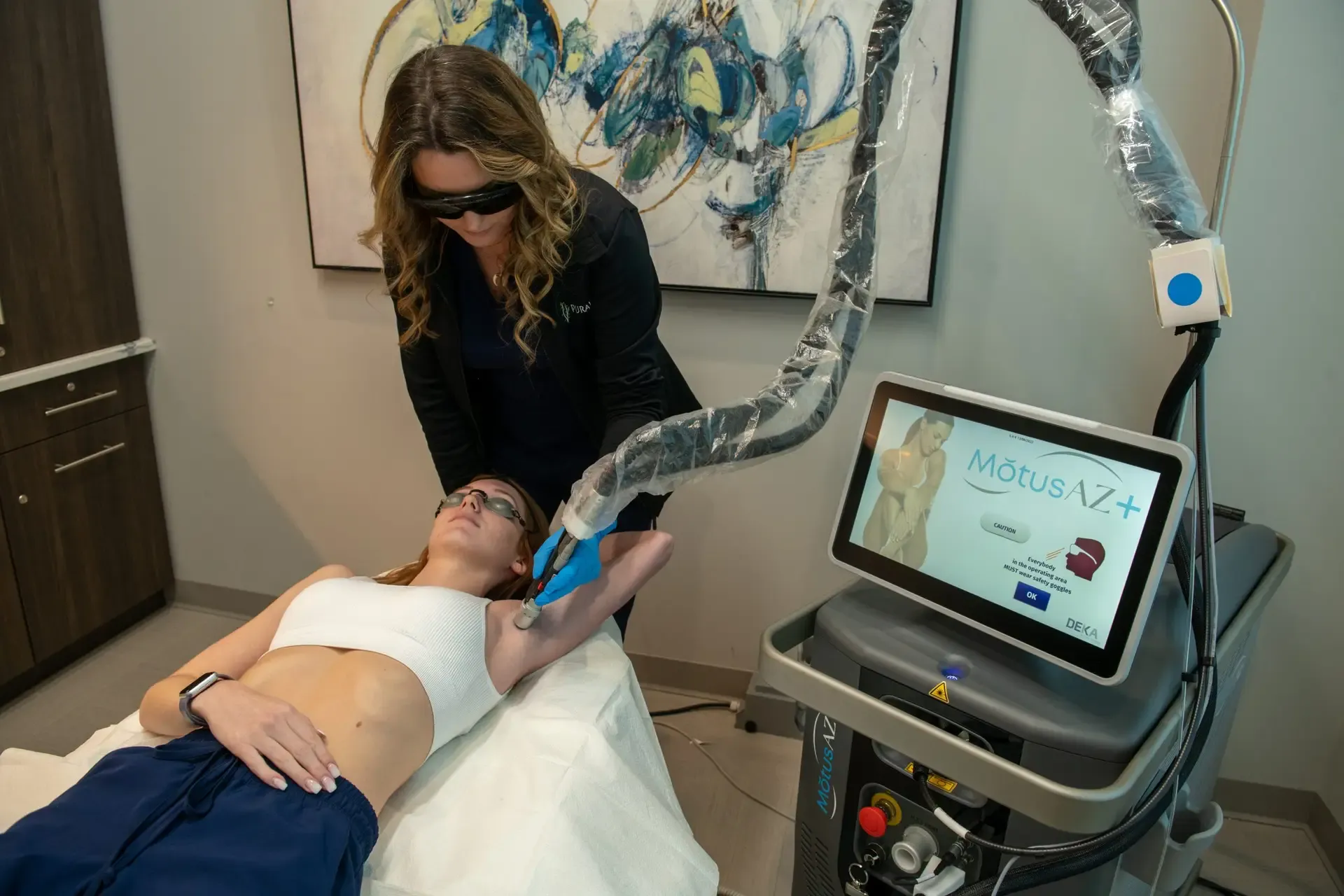 Refined woman receiving Motus AX laser hair removal treatment at Pura Vida Med Spa in Maryland