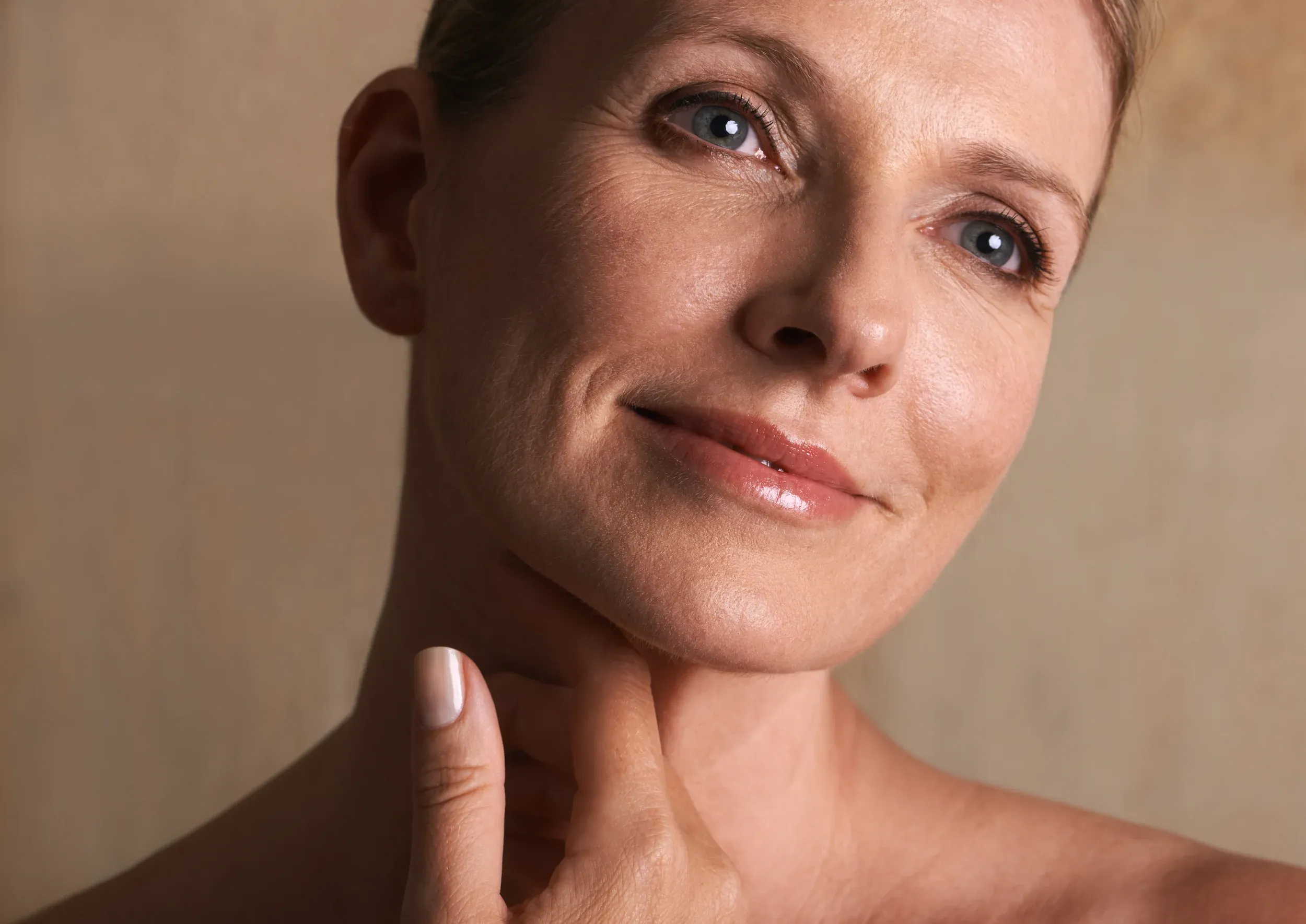 Person concerned about facial aging at Ivy Collaborative Healthcare