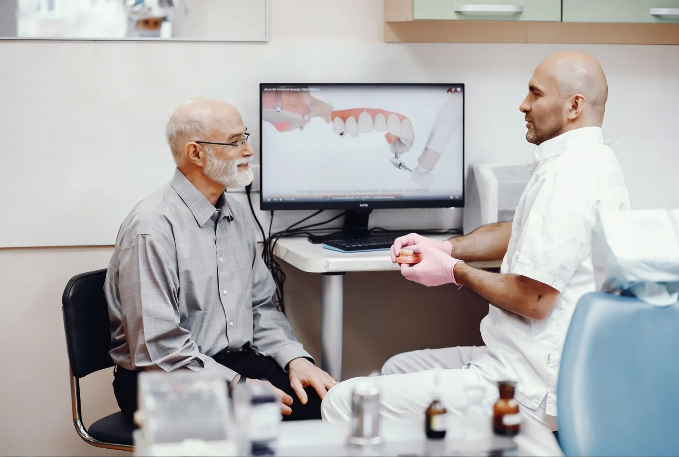 Patient smiling after All-on-4 dental implant treatment at Cook Family Dentistry in Santa Rosa Beach, FL