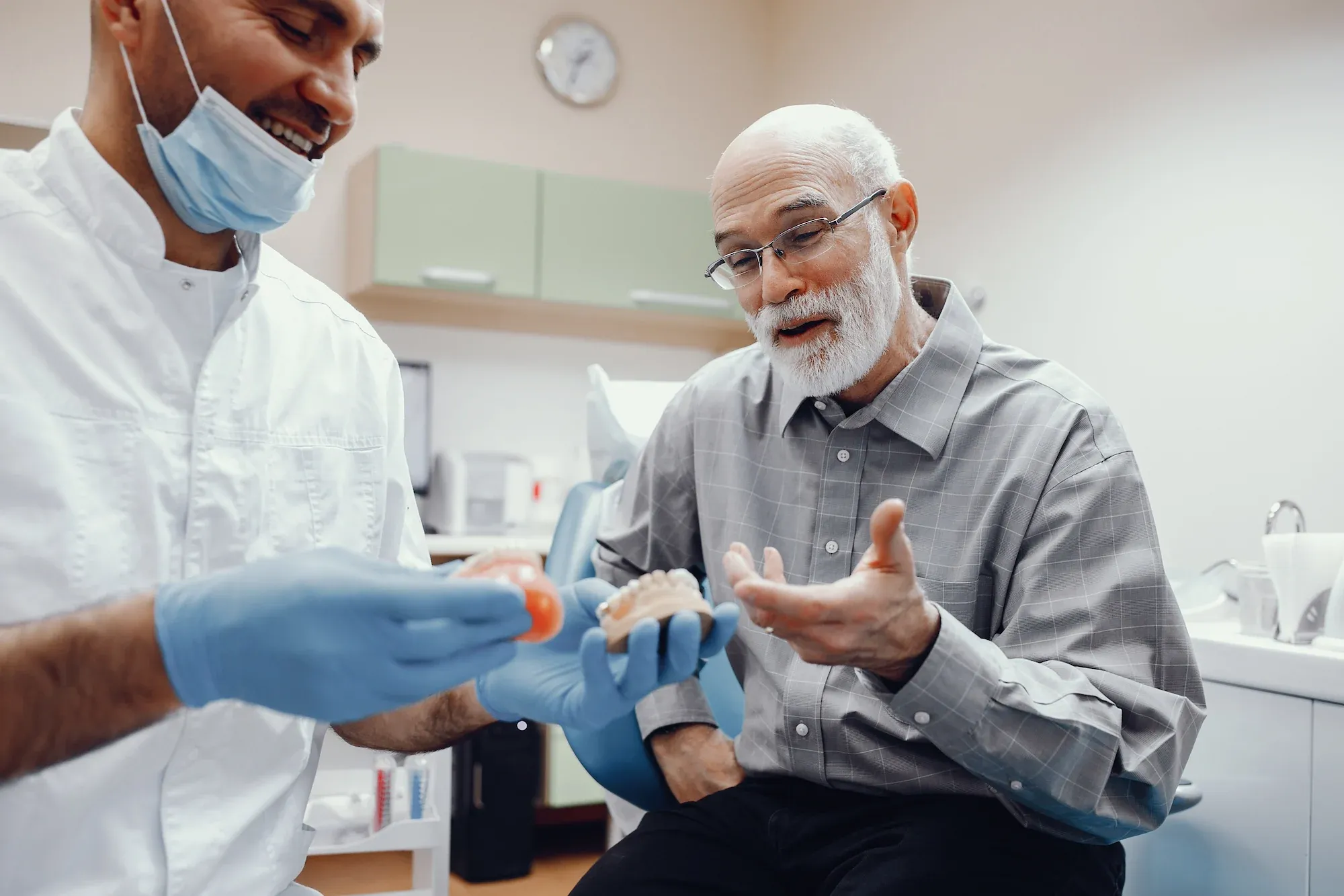 Patient receiving All-on-X full-arch implant consultation at Cook Family Dentistry