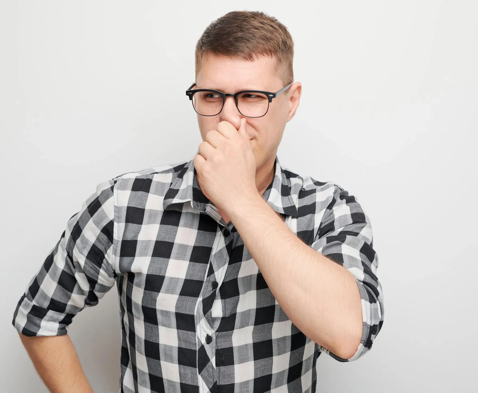 Person looking uncertain about their breath, prompting professional consultation