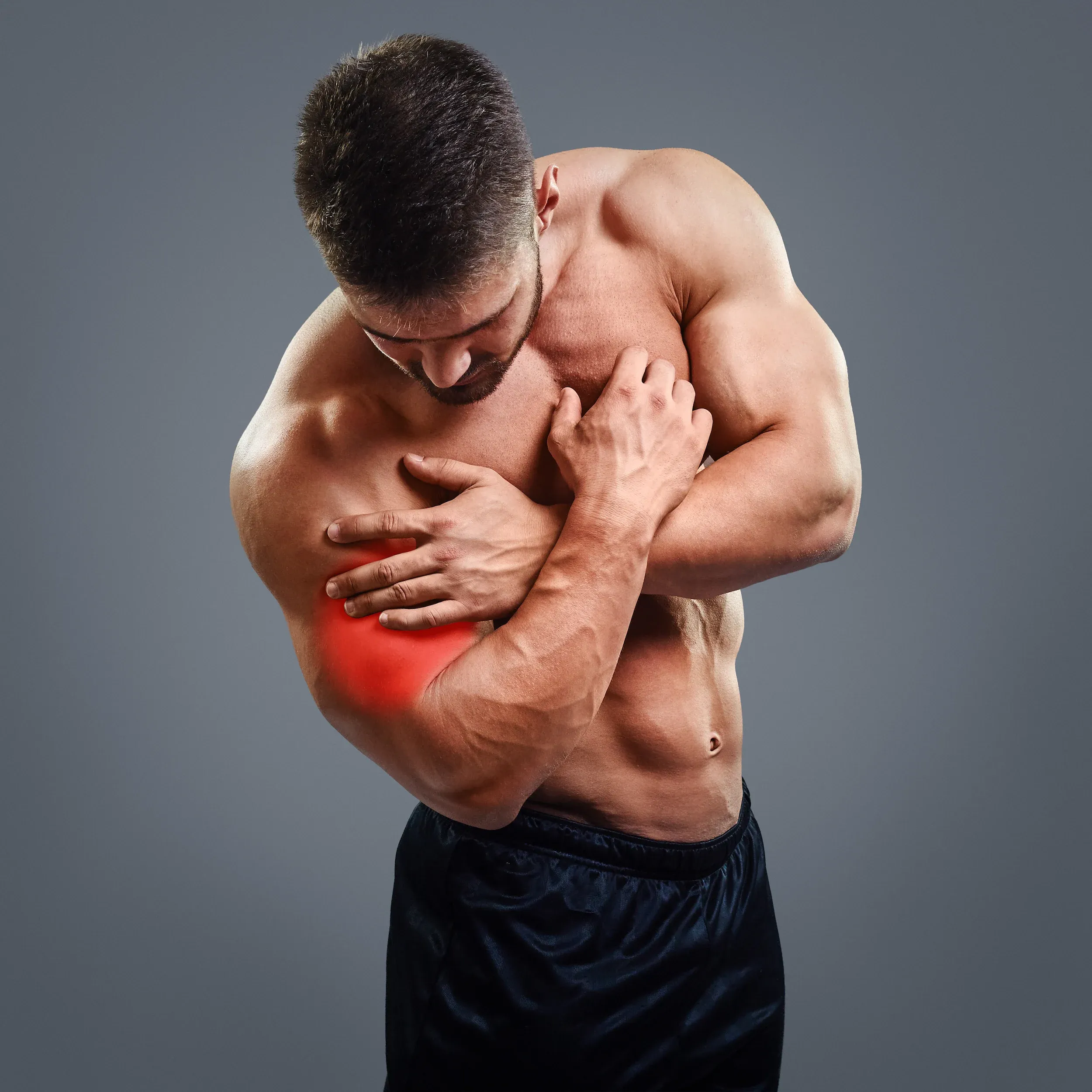 Patient describing muscle spasm symptoms to a chiropractor at Spine-Ability