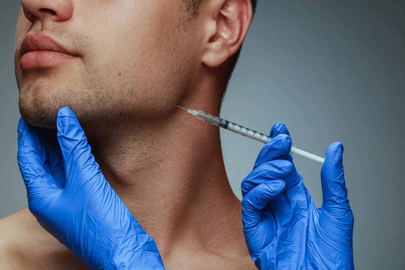 Patient receiving therapeutic Botox injections for TMJ relief at Cook Family Dentistry