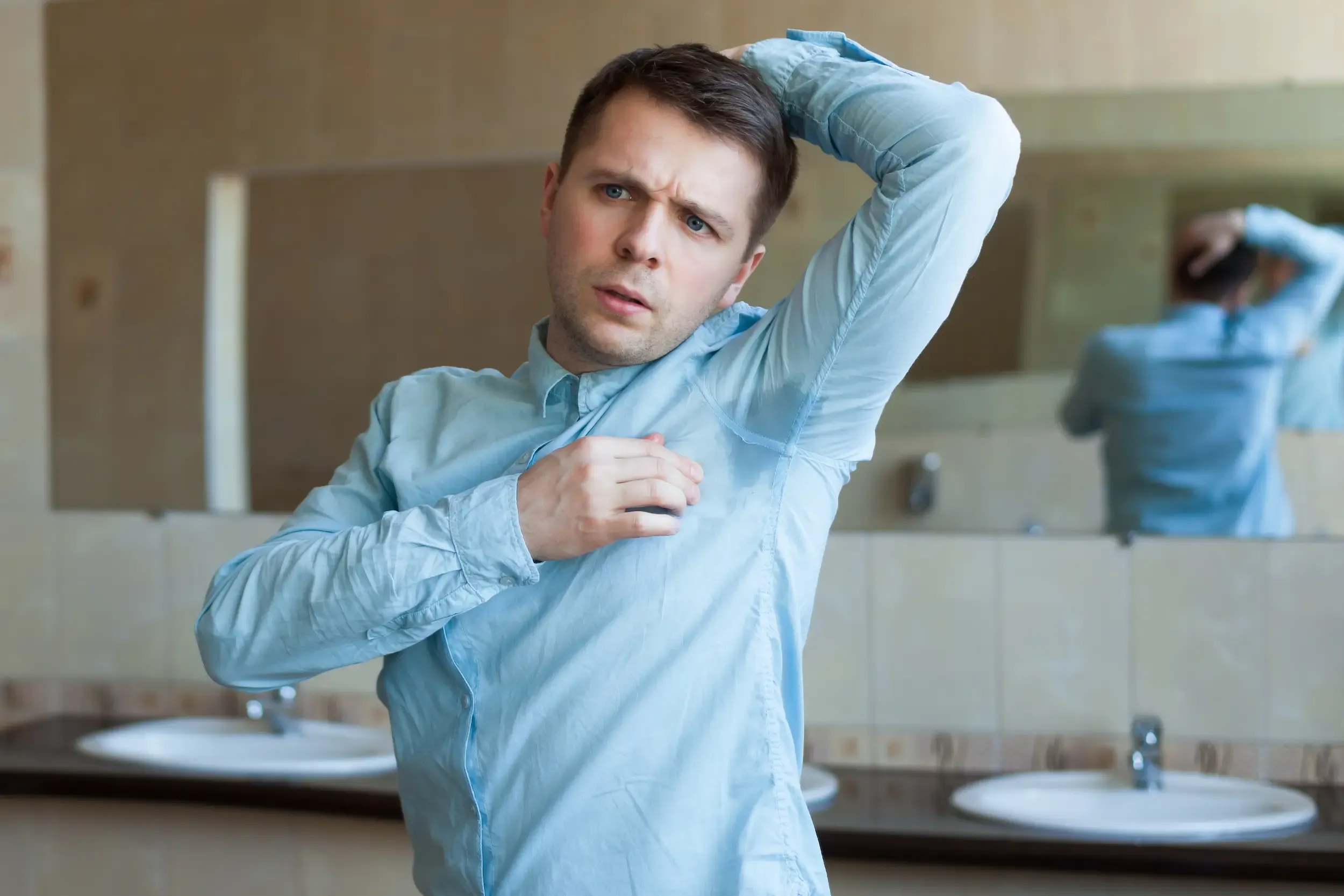 Person addressing excessive sweating concerns at Heritage Wellness & Med Spa Crescent Springs