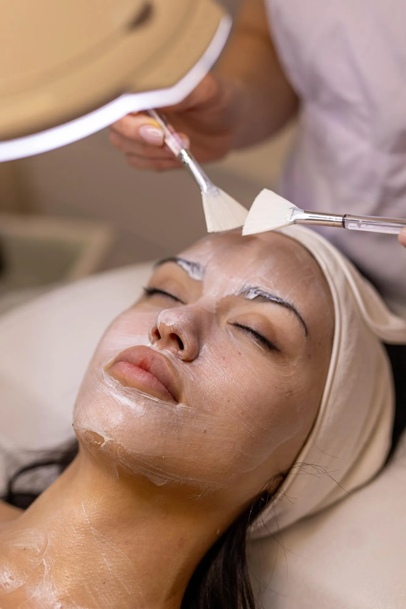 Confident patient with healthy glowing skin after chemical peel treatment
