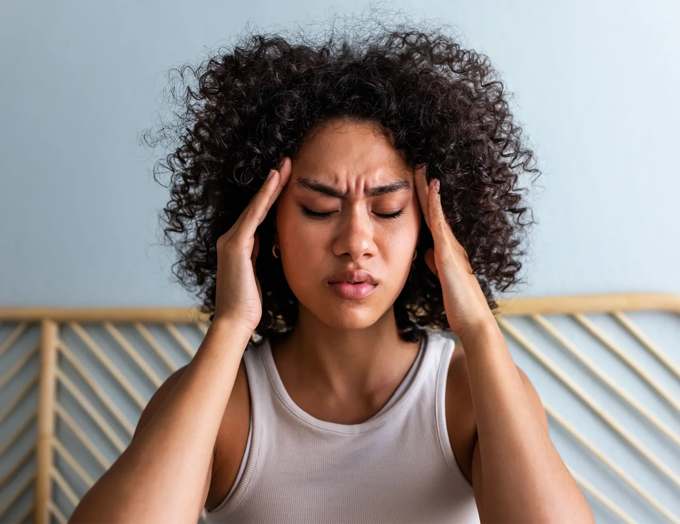 Person recognizing chronic migraine symptoms and considering treatment