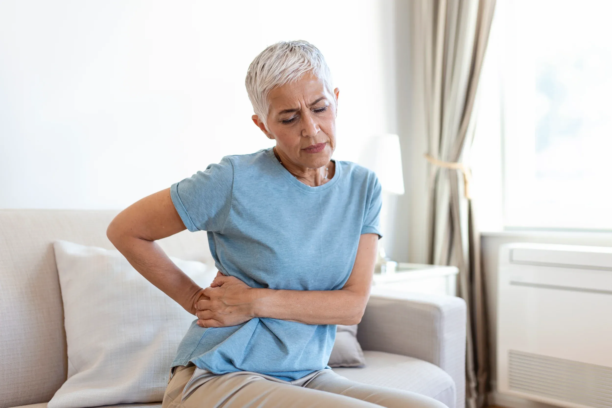 Adult living with chronic pain before treatment at Reliance Primary & Urgent Care Jacksonville