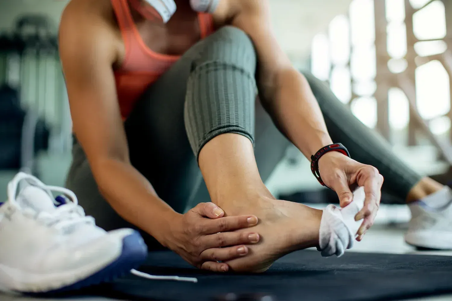 Athlete receiving sports injury assessment at Roots Chiropractic and Wellness Alma
