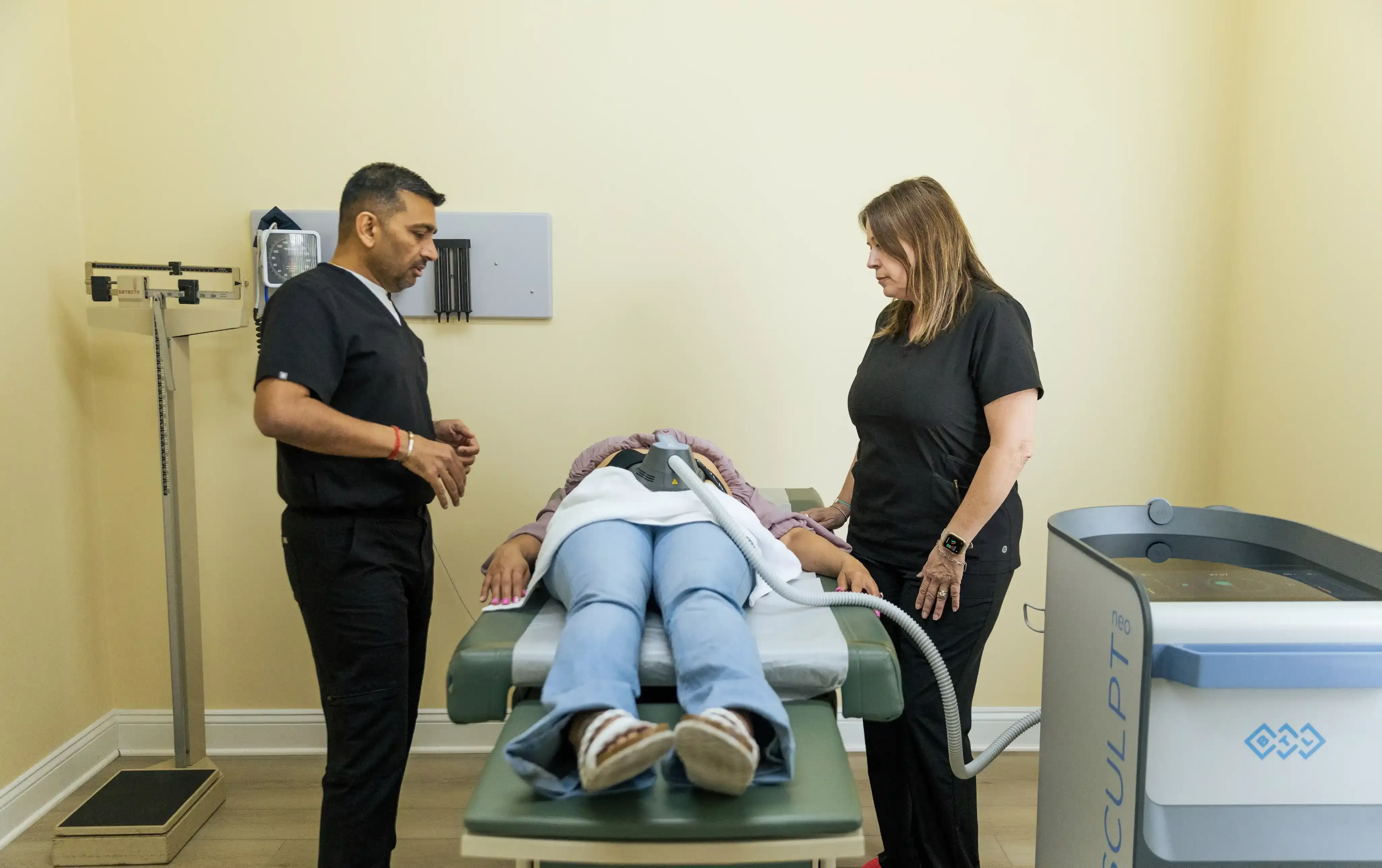 Patient receiving functional muscle stimulation therapy at Reliance Primary and Urgent Care in Jacksonville, FL