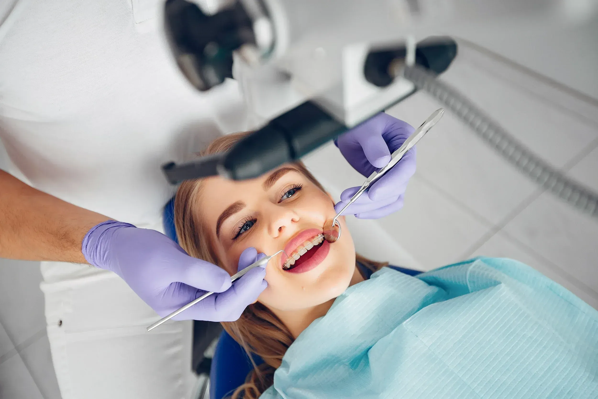 Smiling child receiving a dental sealant application at Cook Family Dentistry in Santa Rosa Beach, FL