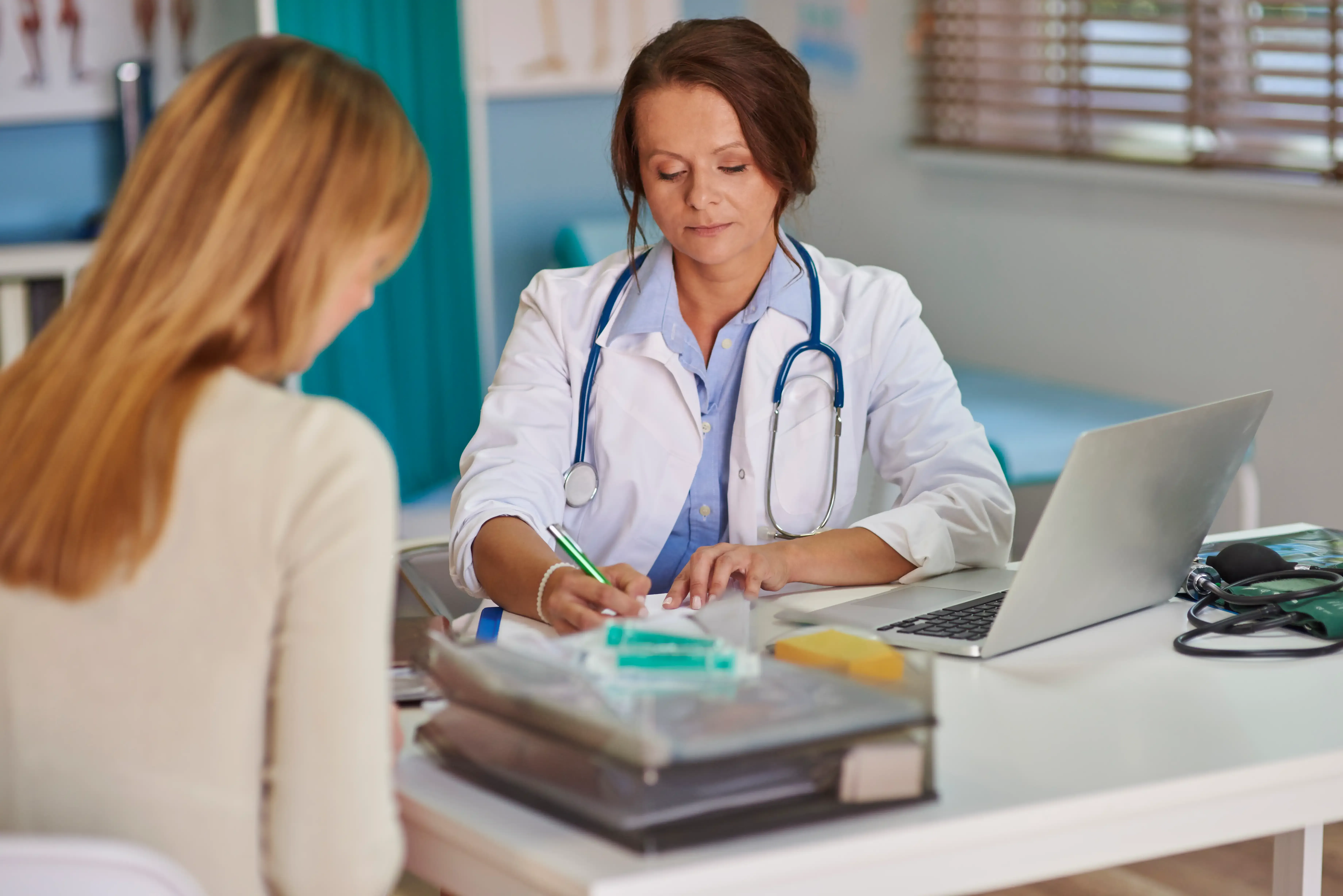 Dr. Patel discussing medical marijuana certification with a patient in Jacksonville, FL
