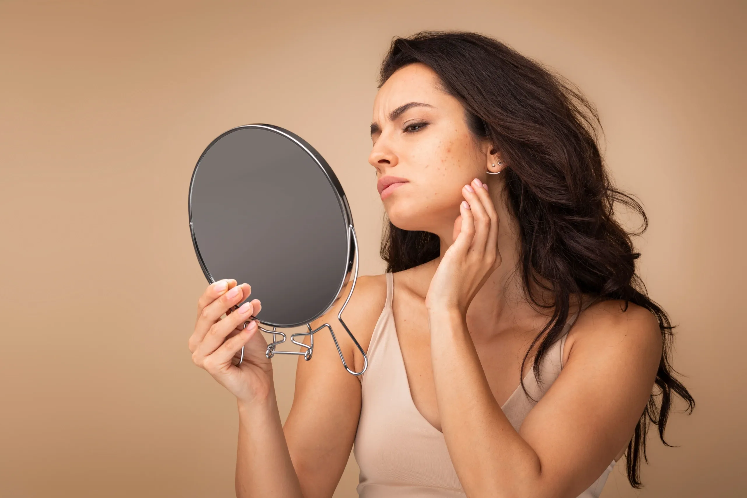 Person concerned about dull lackluster skin at Eternal Wellness Medical Spa Traverse City