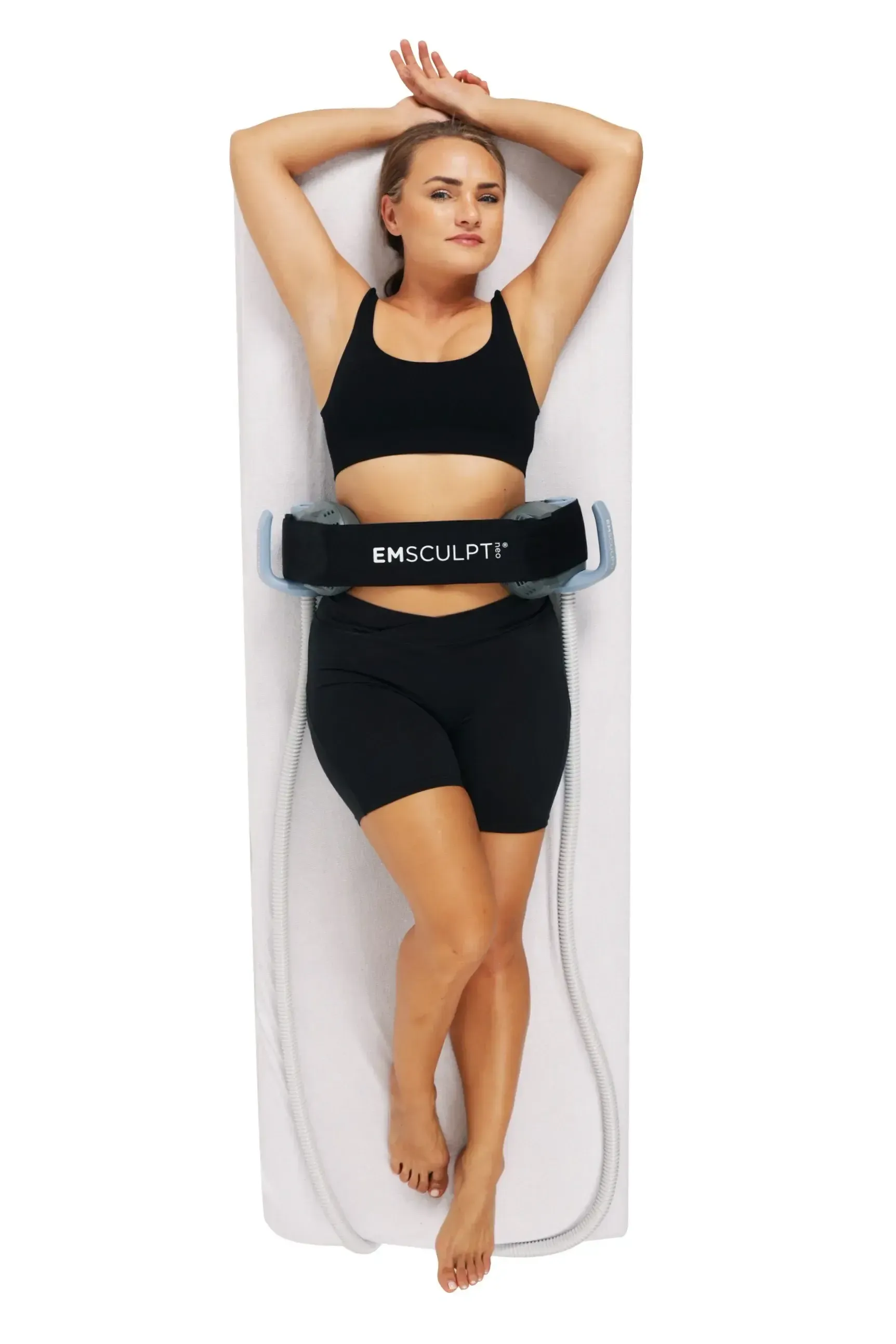 Provider guiding patient through Emsculpt Neo Function rehabilitation session