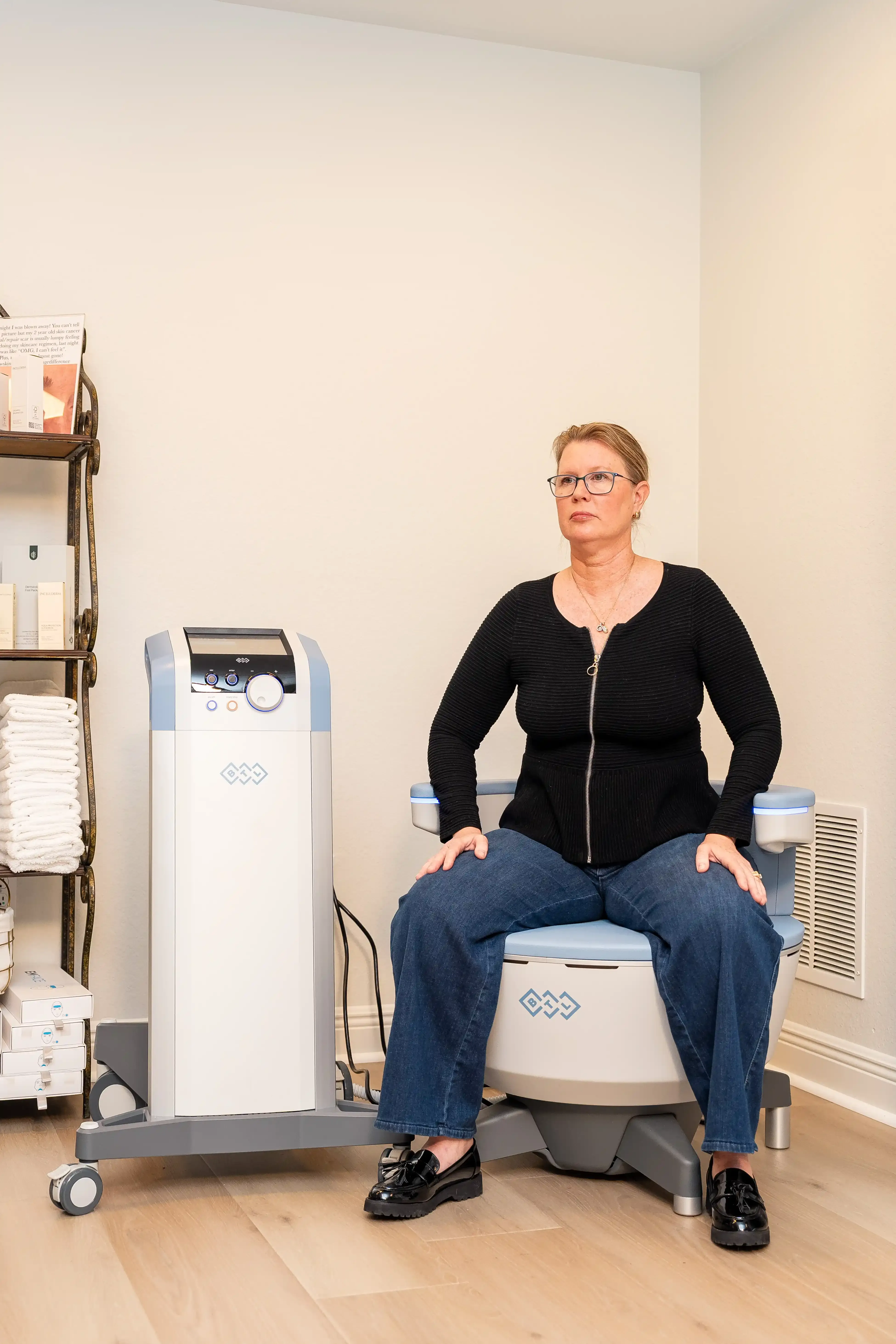 Patient consulting with Dr. Laura Korman about Emsella pelvic floor benefits at Arise Integrative Wellness