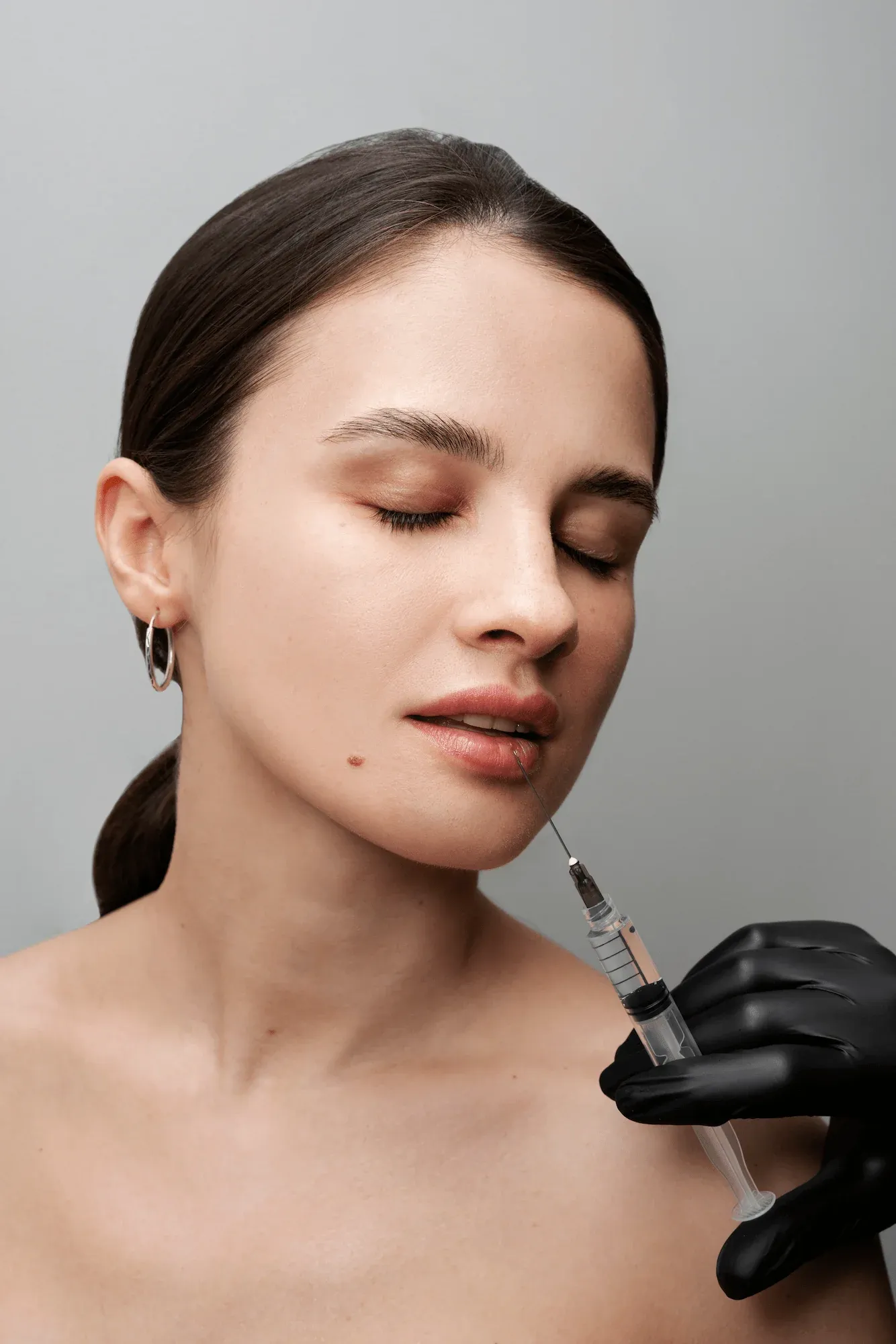 Provider performing a precise injectable treatment at Cook Family Dentistry