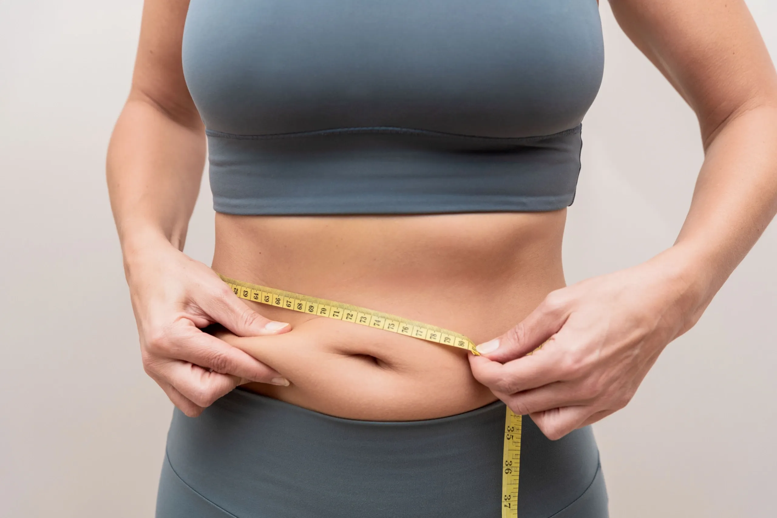 Patient discussing non-invasive fat reduction options at Resurgent Health Fargo