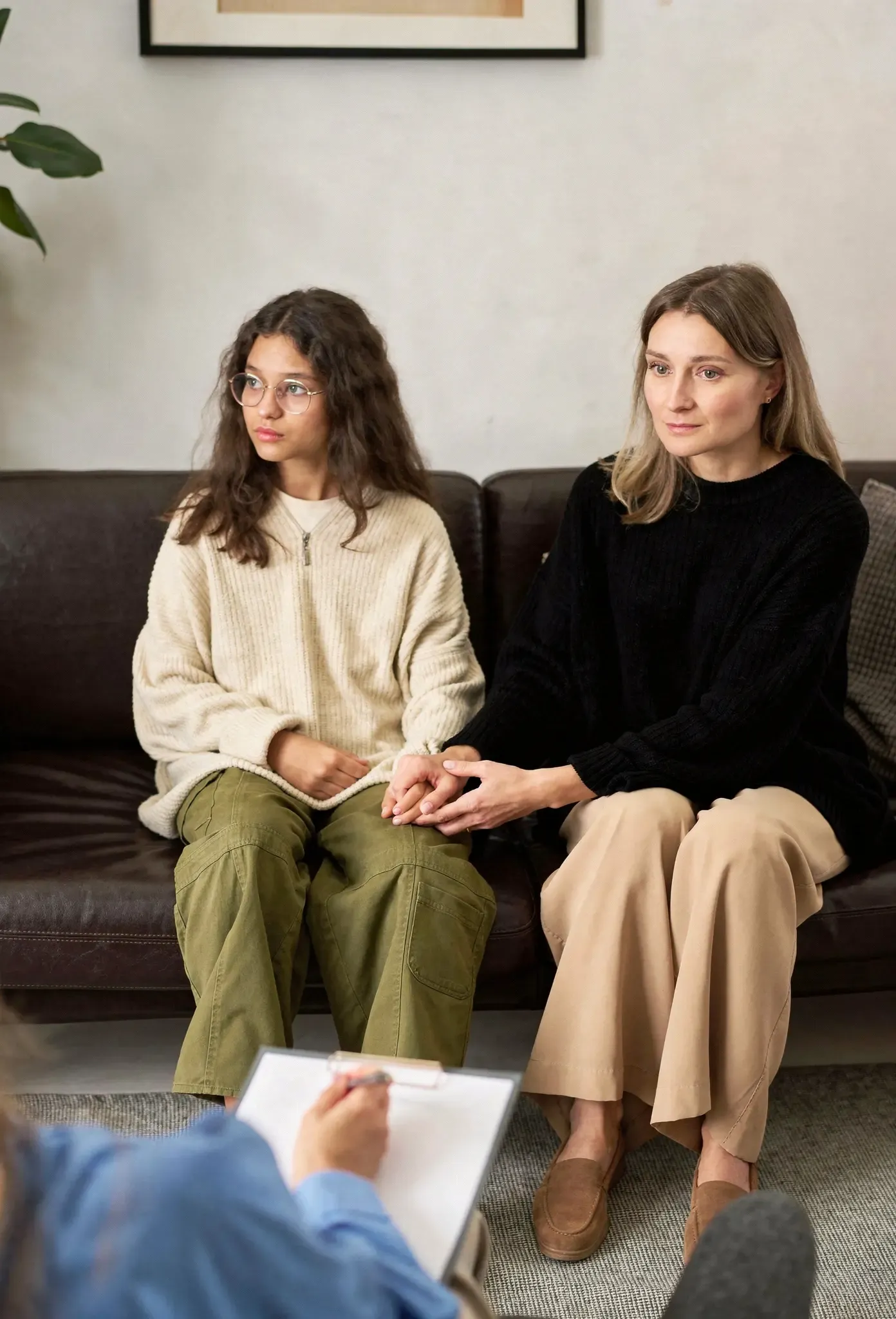 Child psychiatrist consulting with parent and teen at R&C Psychiatry Pembroke Pines