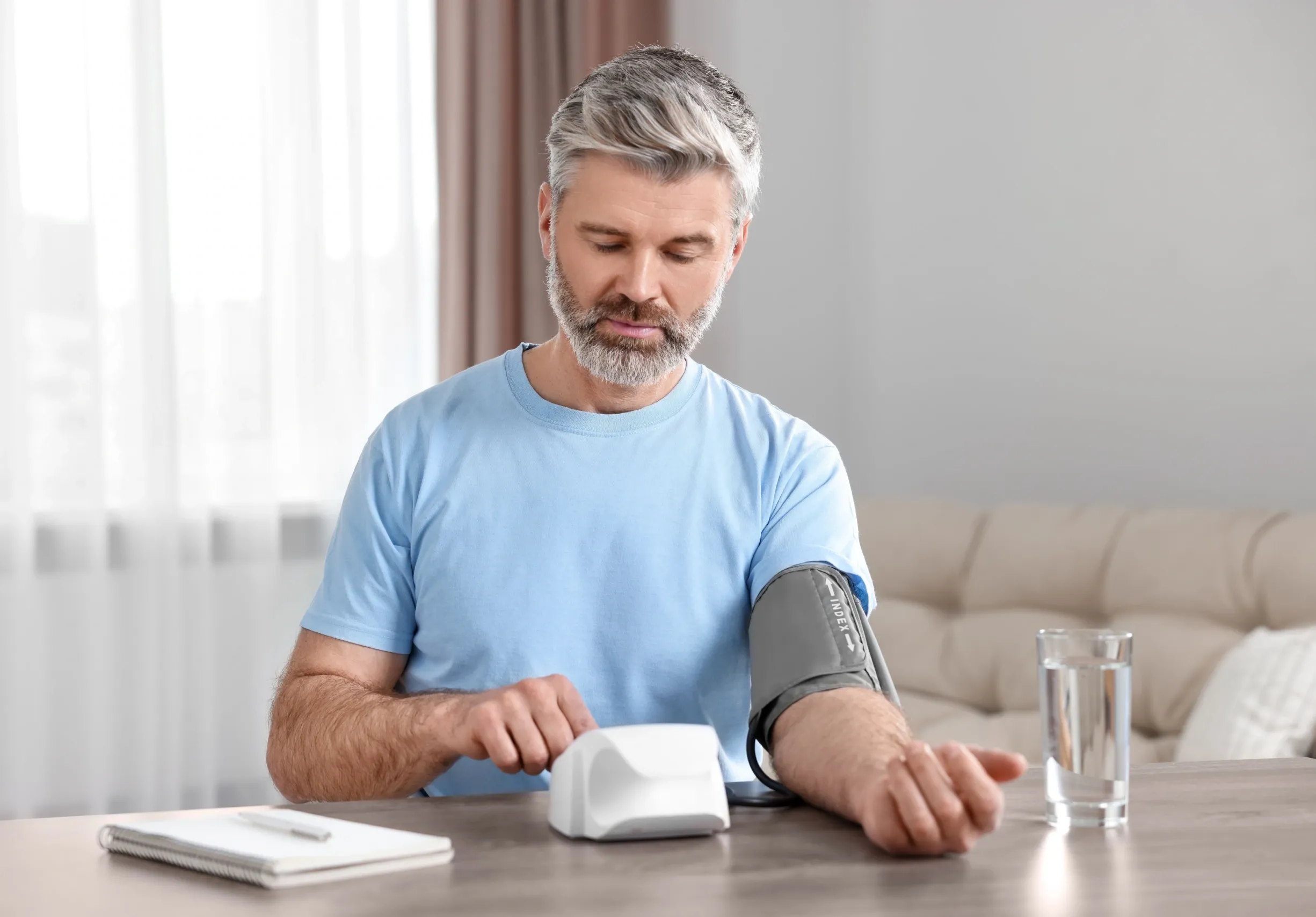 physician measuring blood pressure during Venice FL primary care visit