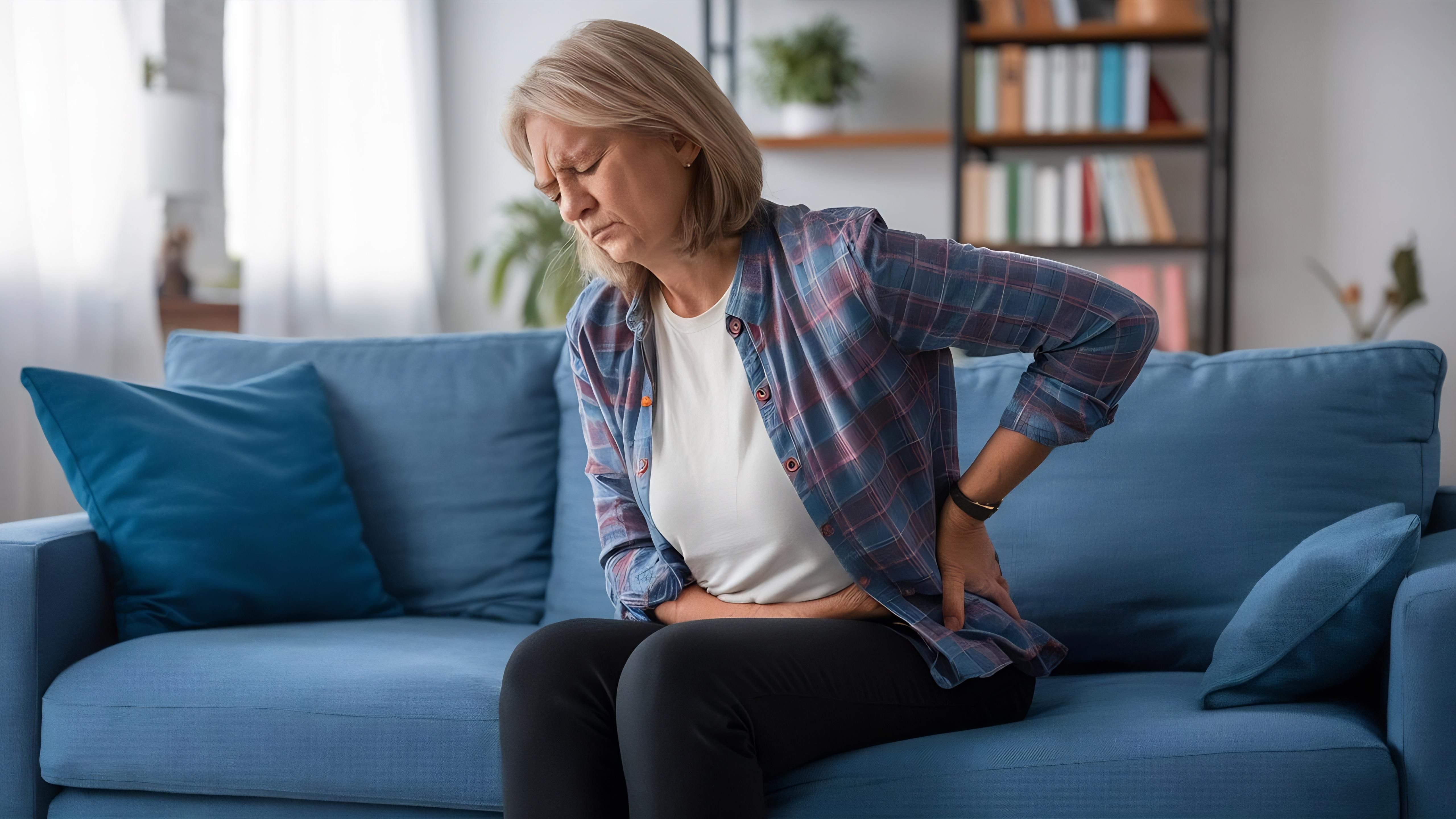 Chiropractor assessing hip joint alignment in a clinical setting in Alma, GA