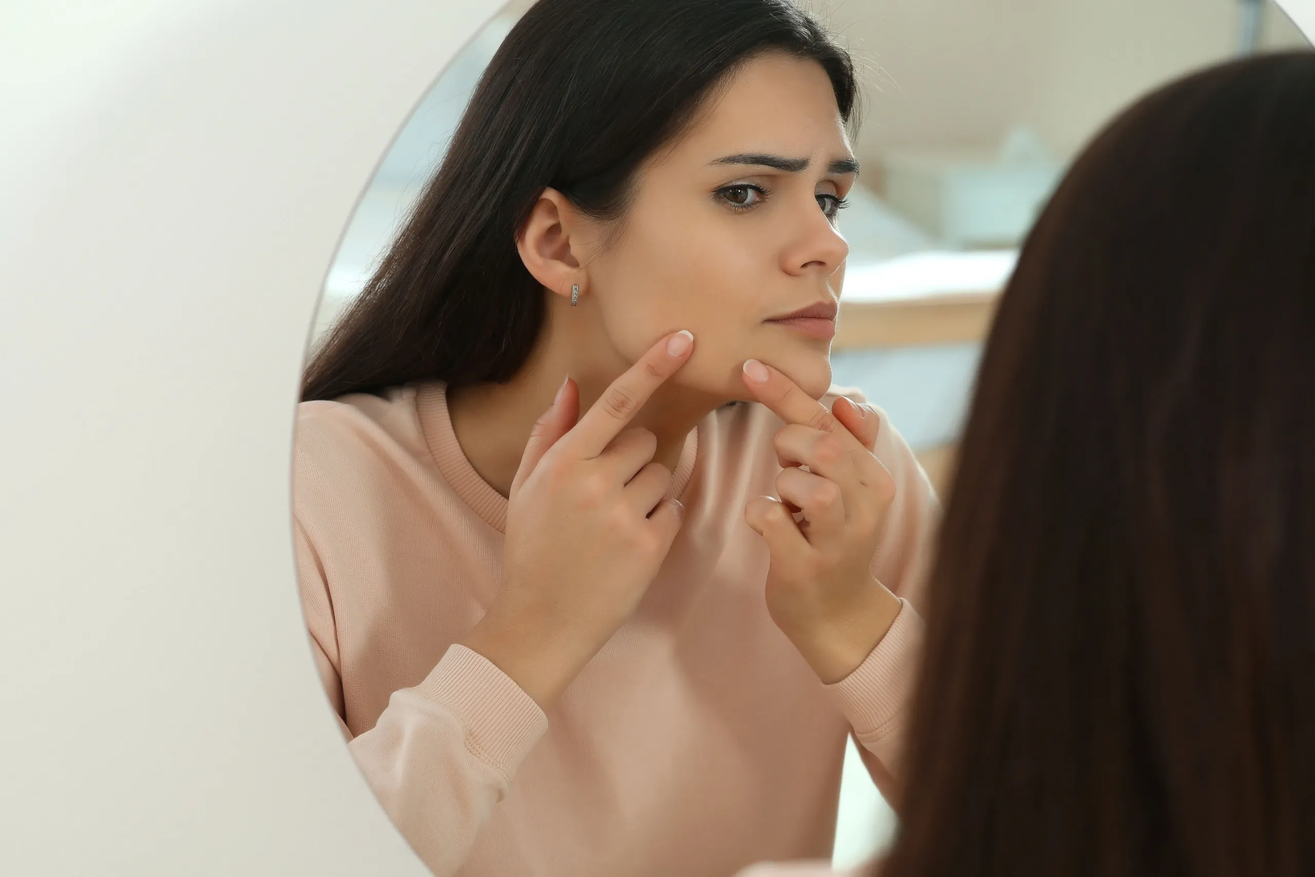 Woman in Canton concerned about hormonal imbalance symptoms at Hartley Health and Wellness
