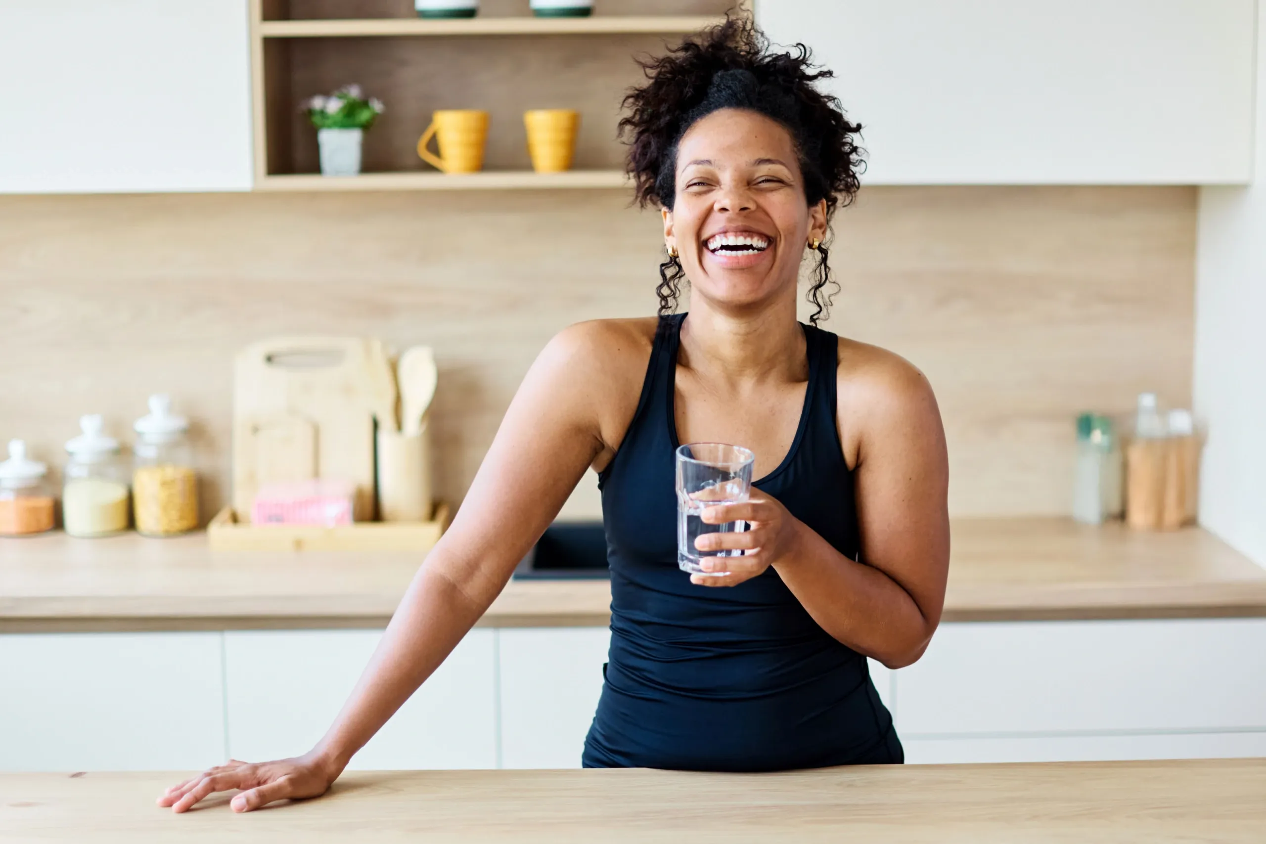 Woman discussing hormone replacement therapy options with physician in a modern integrative medicine clinic