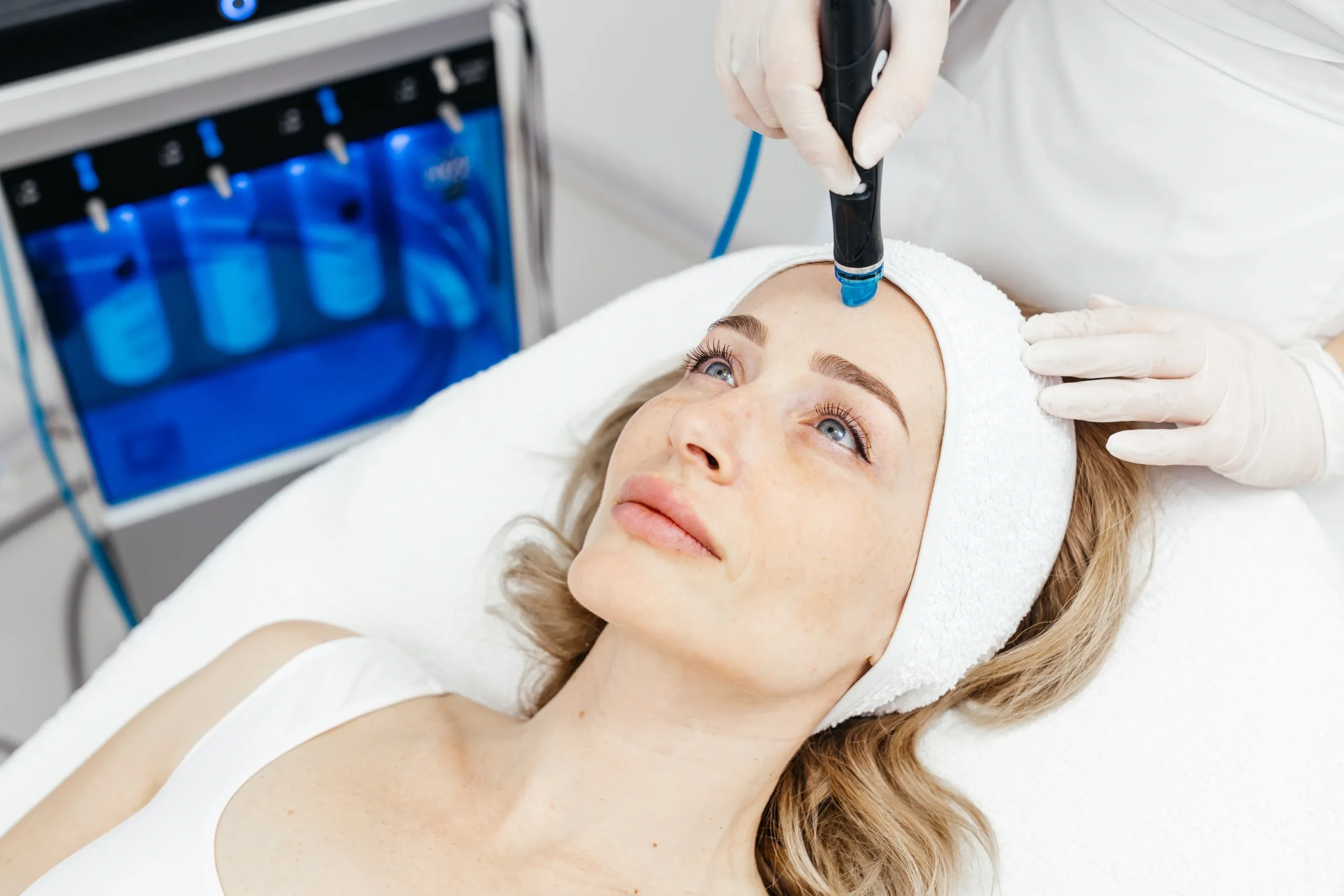 Woman receiving a Hydrafacial Syndeo treatment at Mint Aesthetics & Skin in Indianapolis, IN