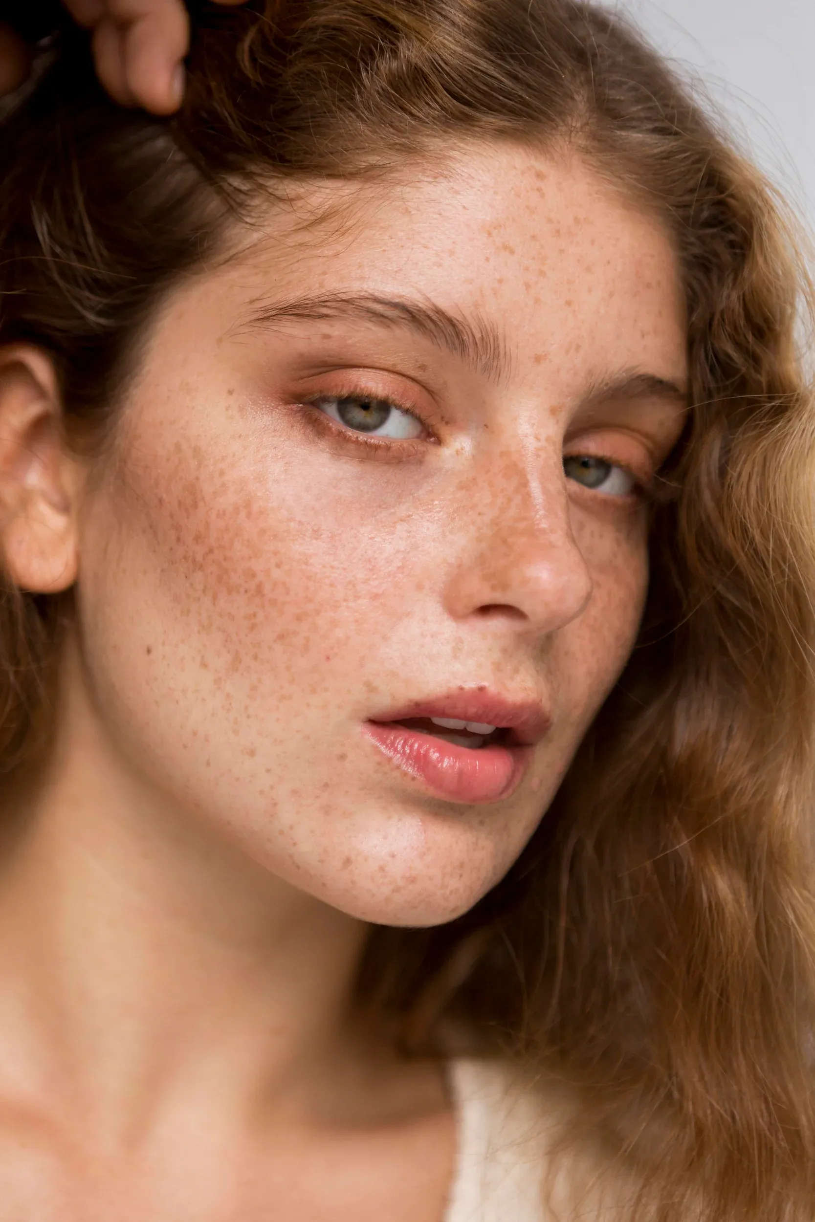 Person concerned about uneven skin tone consulting a provider at Resurgent Health Fargo