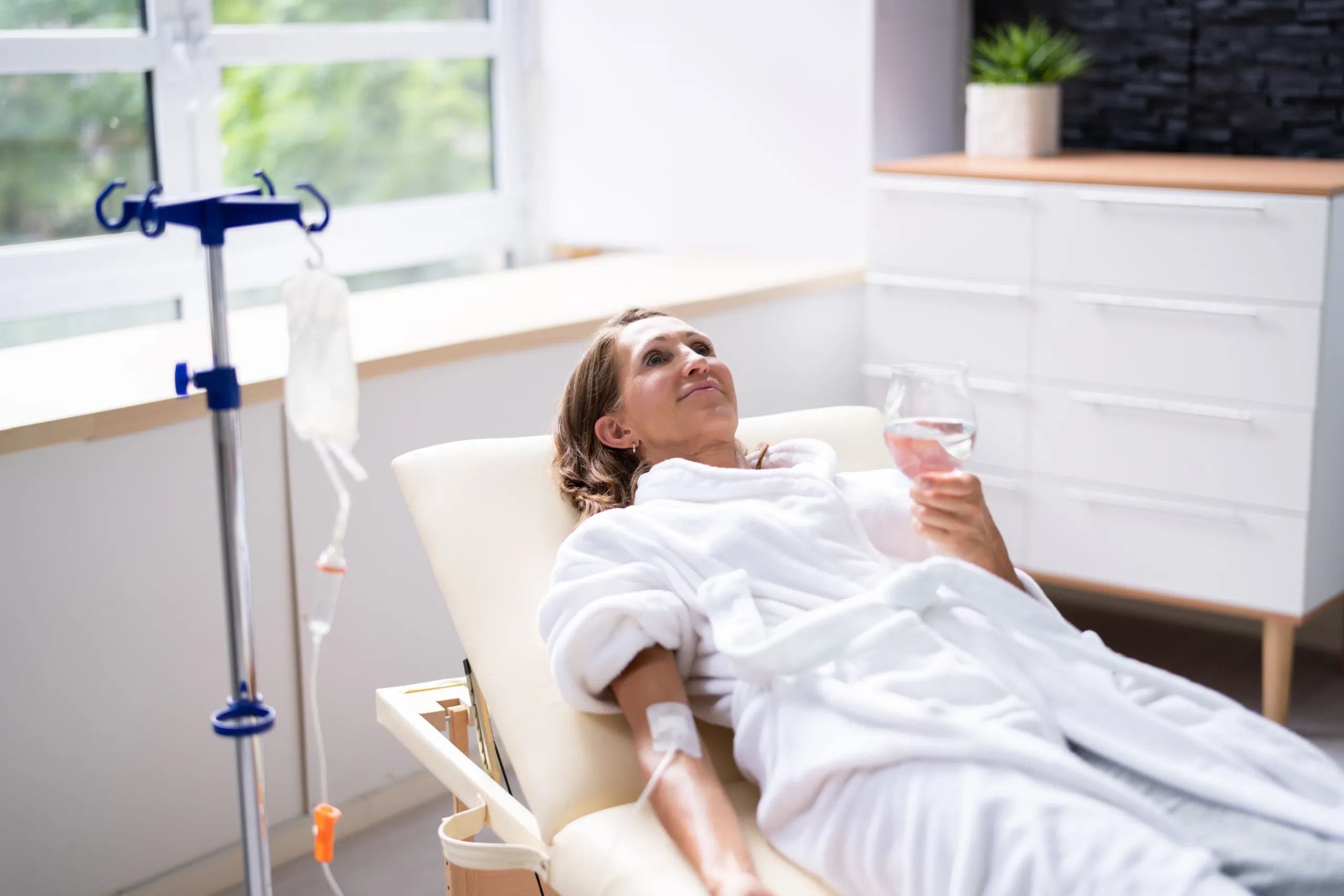 Patient receiving immunity booster IV therapy in medical wellness setting