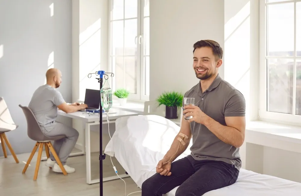 Patient consultation discussing IV therapy benefits