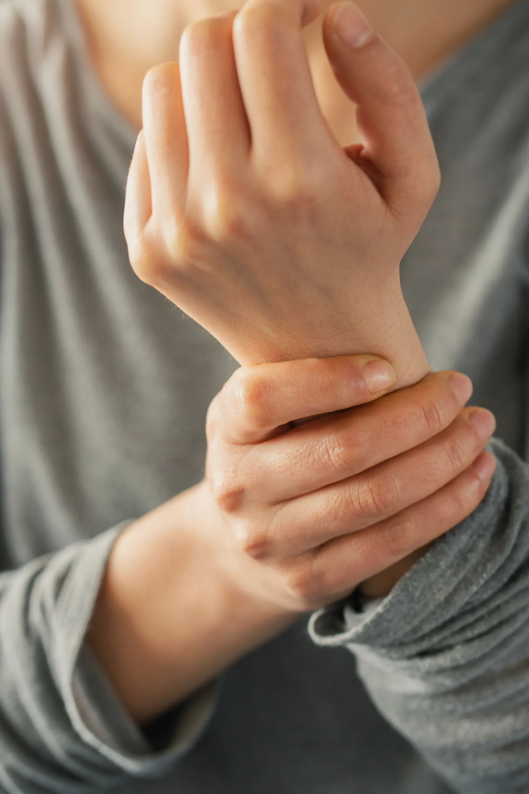 Adult patient discussing joint pain with Dr. Martens at Resurgent Health Fargo