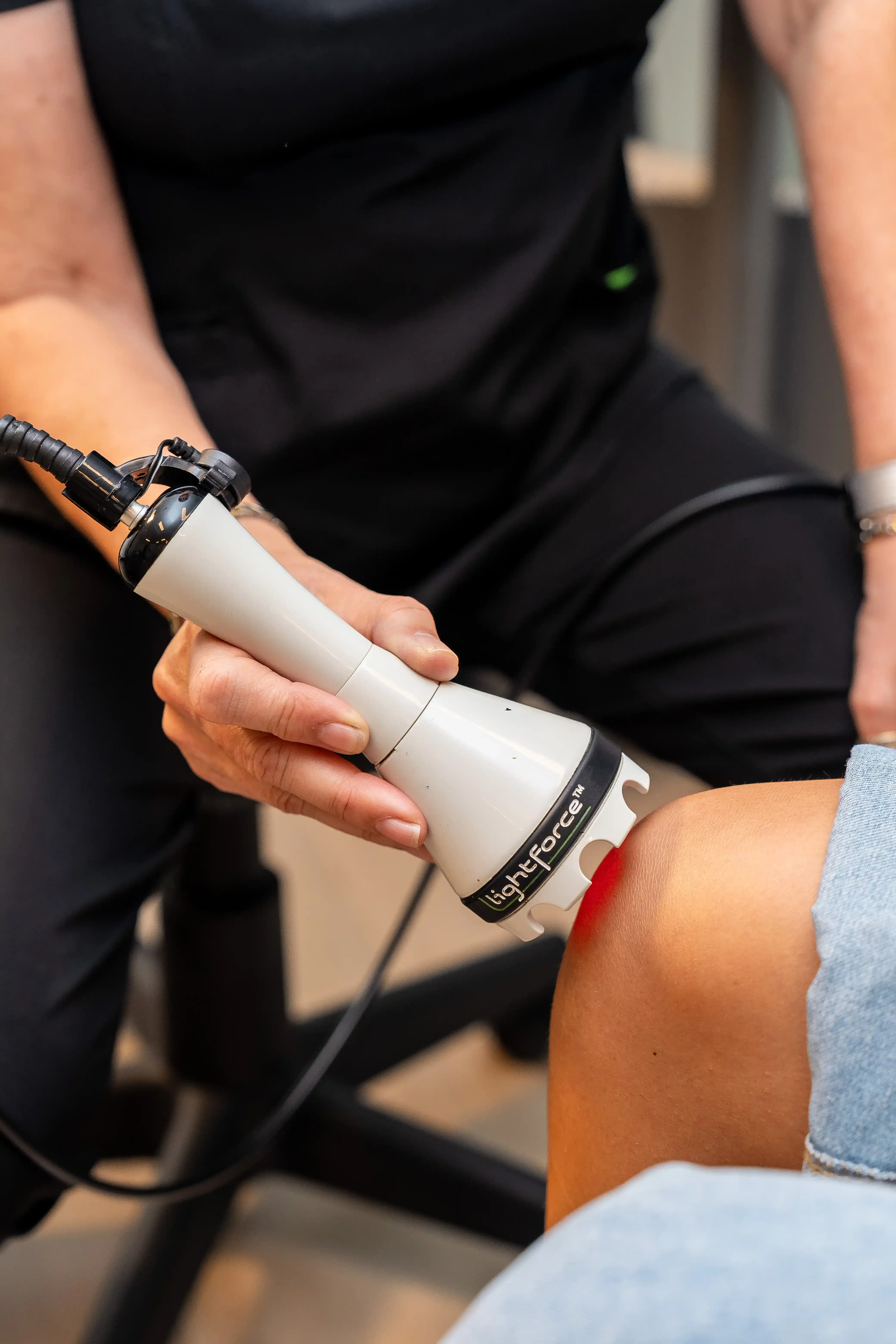 LightForce Class IV therapy laser equipment used at Arise Integrative Wellness Port Charlotte