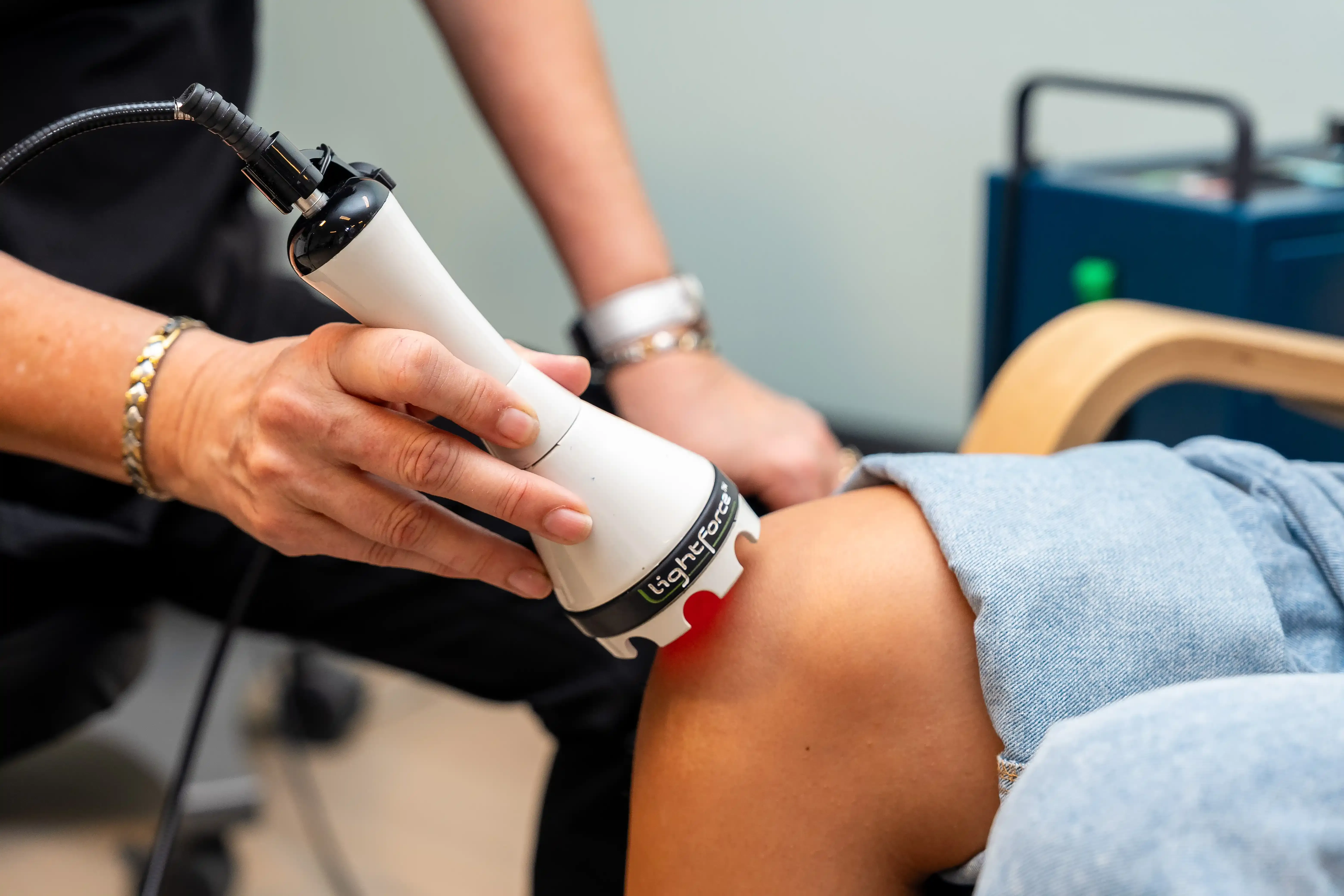 Confident patient ready for LightForce laser therapy consultation at Arise Integrative Wellness Port Charlotte