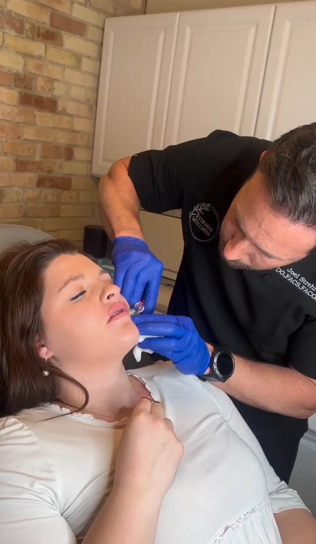 Confident patient portrait after lip injections at Eternal Wellness Traverse City