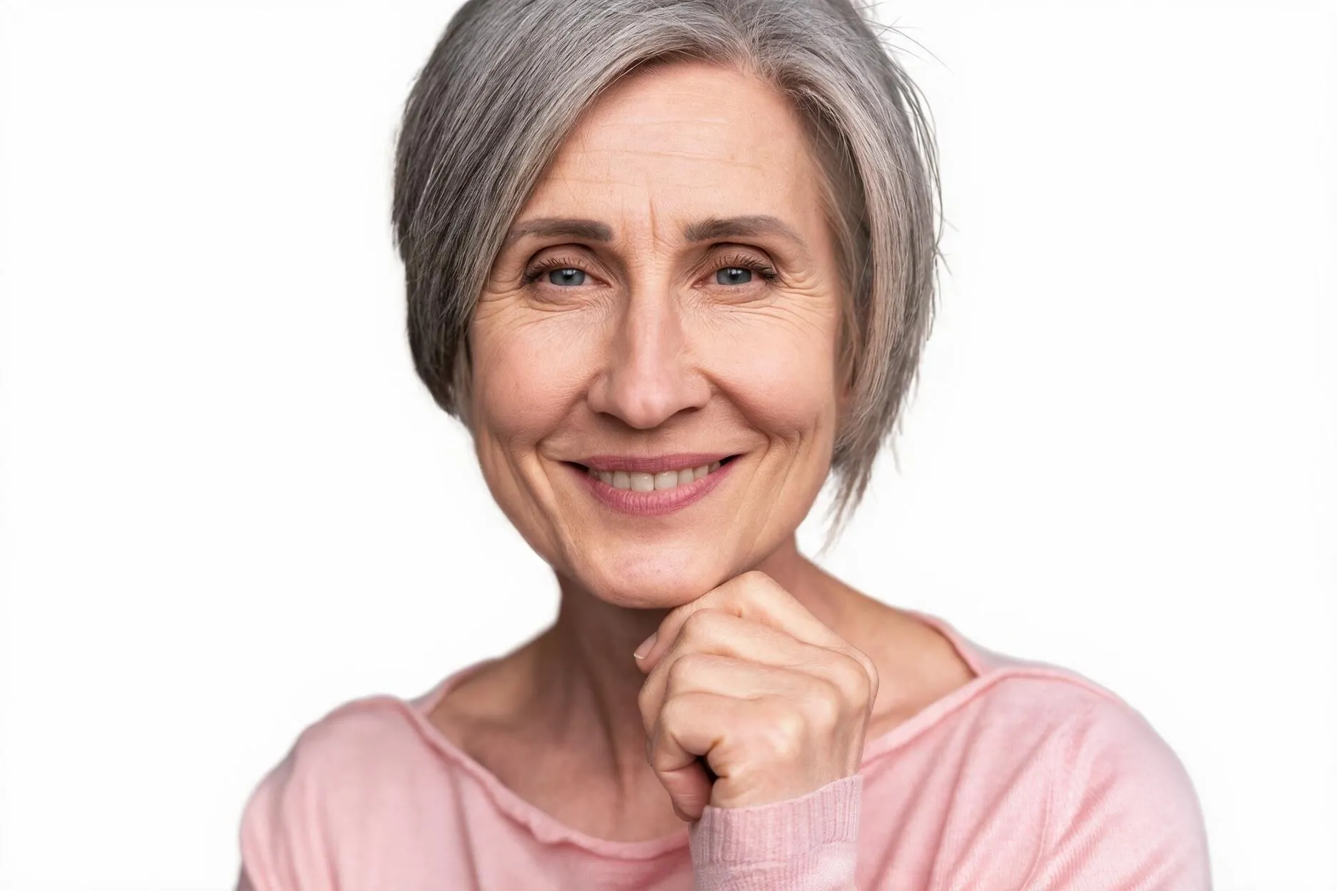 Woman reviewing her nasolabial folds in the mirror at Healthy Enhancements Wellington, FL