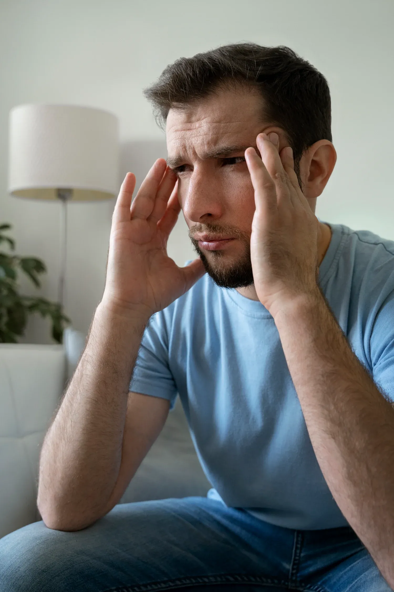 Person concerned about chronic headaches at Bensa Chiropractic and Wellness