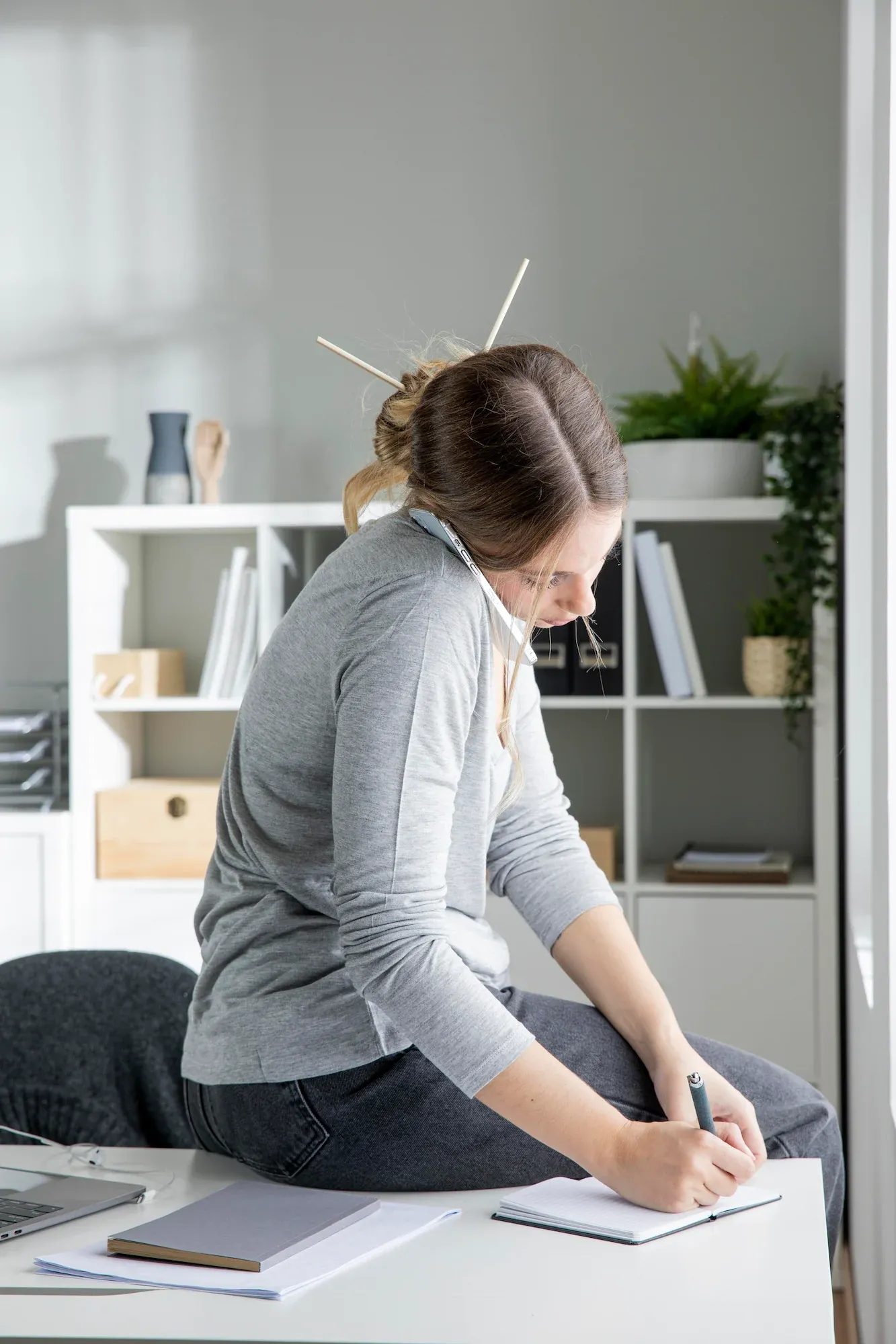 Person concerned about posture problems at Roots Chiropractic and Wellness Alma