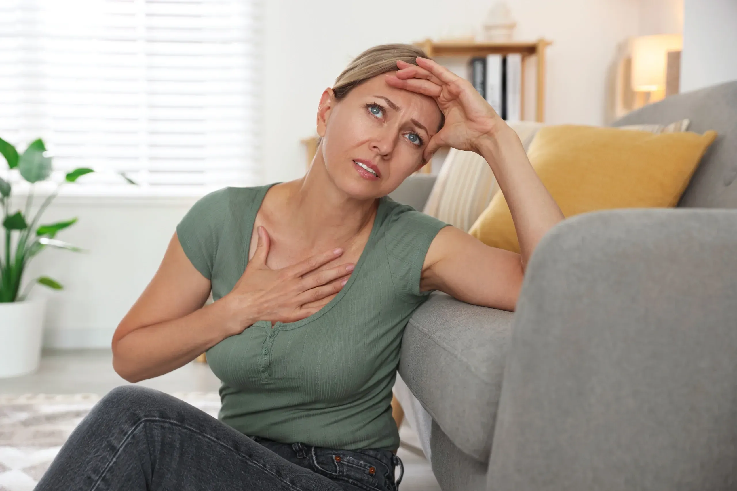 Woman examining hormone wellness information at Hartley Health and Wellness