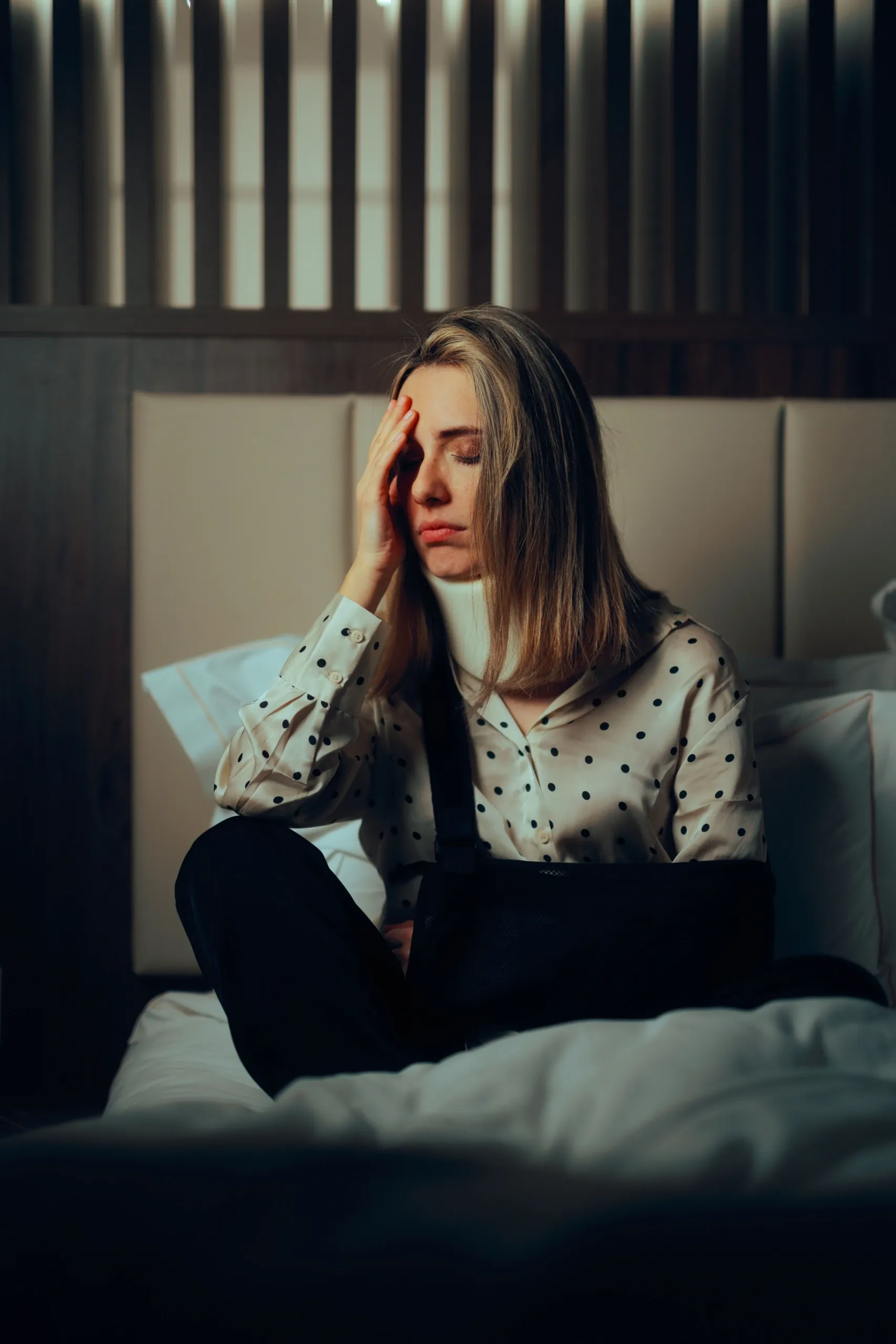 Patient discussing recurring headaches with Dr. Kristine Martens at Resurgent Health Fargo
