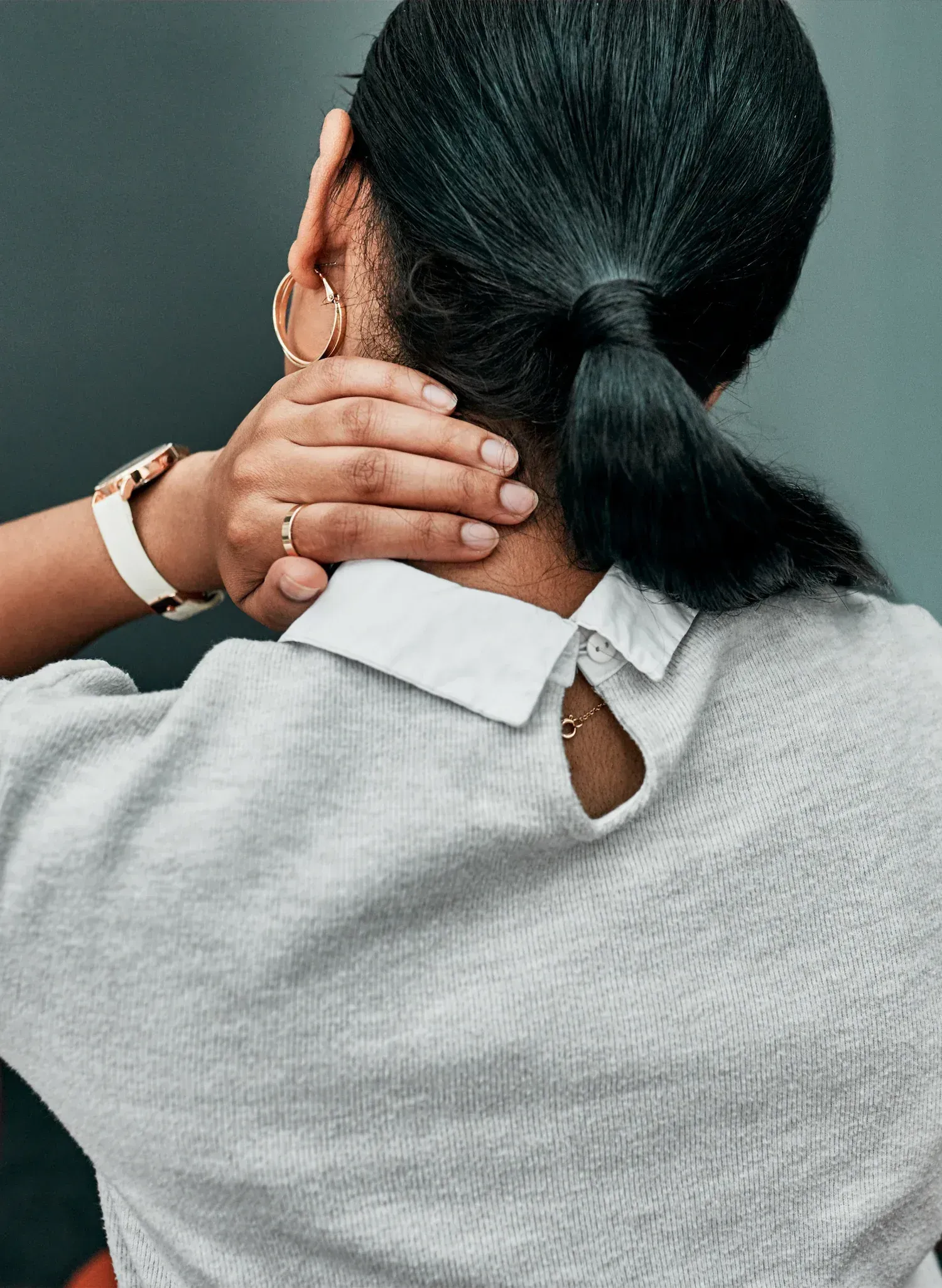Close-up of tense cervical spine area at Resurgent Health Fargo
