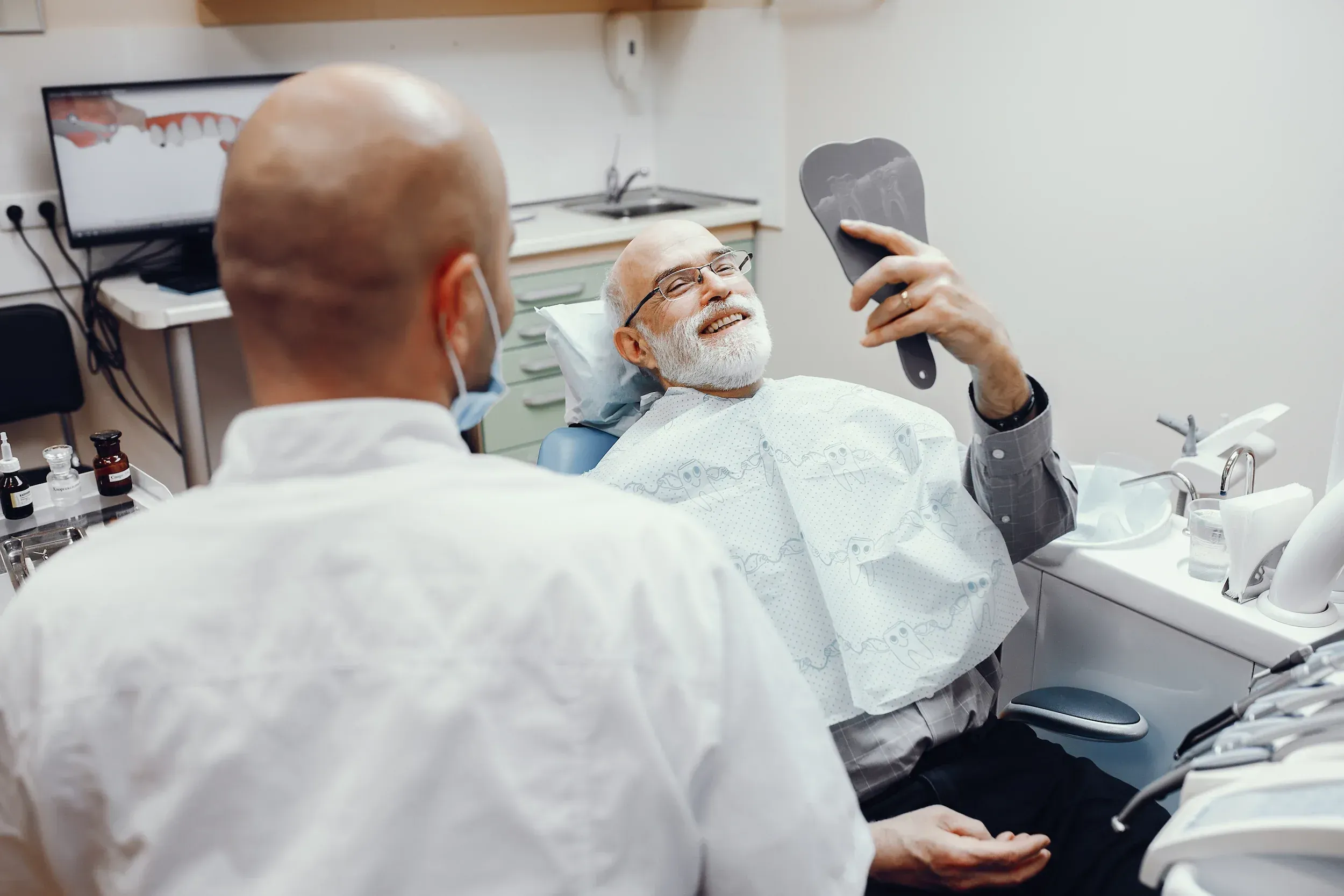 Dr. Cook performing a gentle oral cancer screening at Cook Family Dentistry