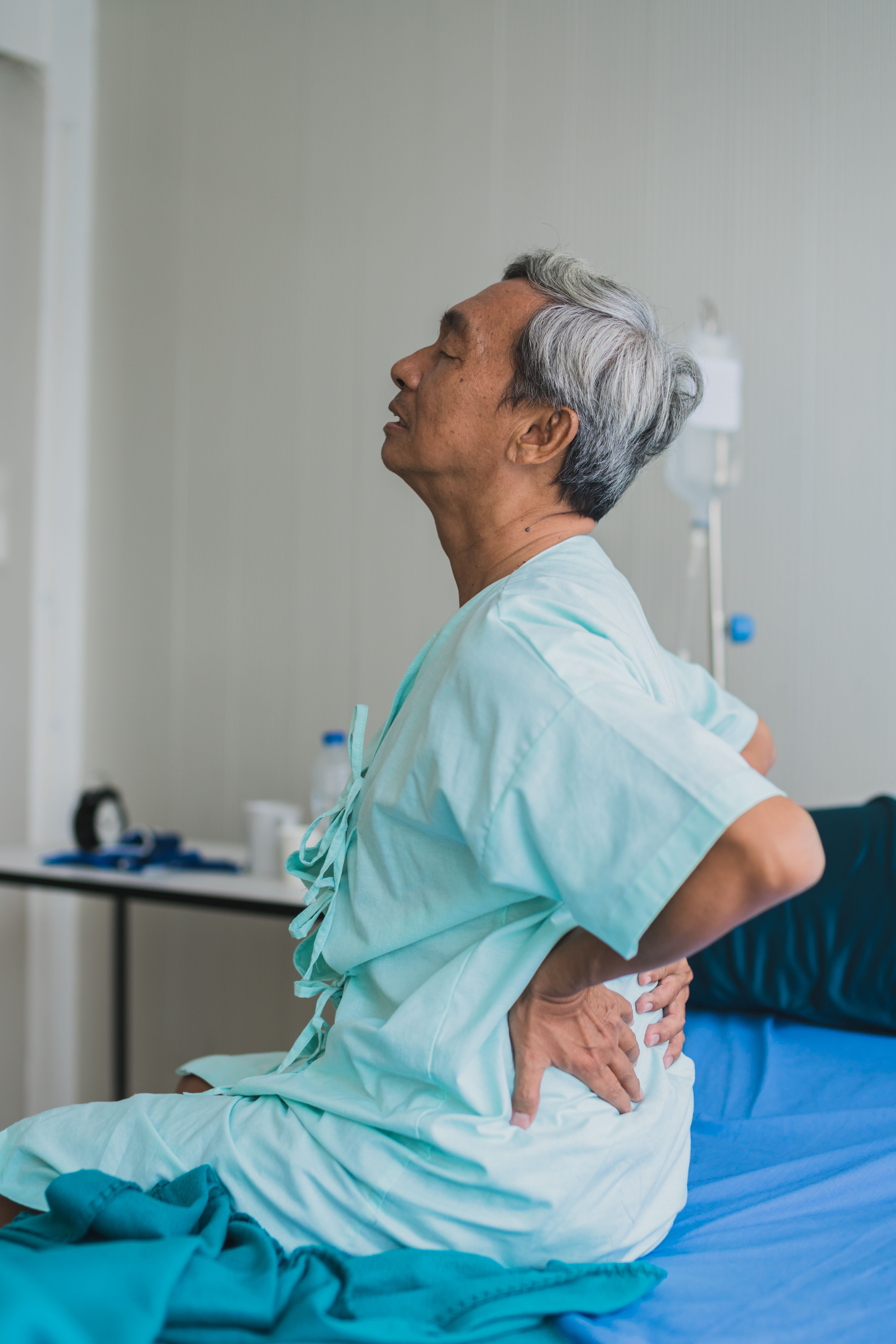 Patient concerned about back pain at Roots Chiropractic and Wellness